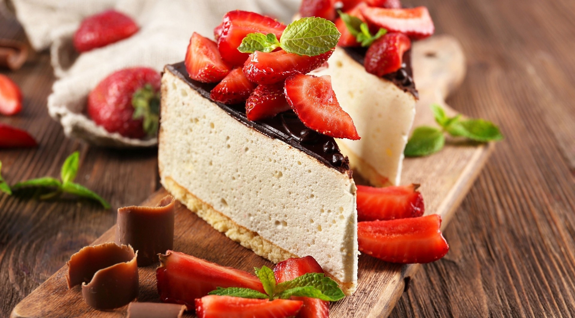 General 1919x1060 strawberries Cheesecake fruit sweets food cake mint leaves cutting board wooden surface chocolate