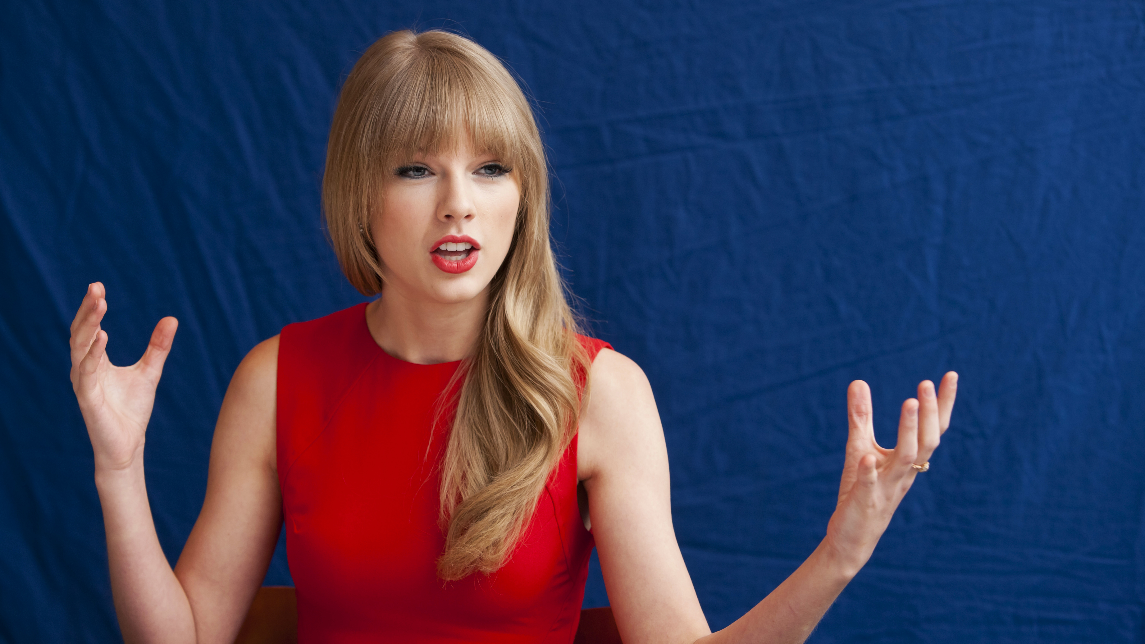 People 3686x2073 Taylor Swift singer women blonde dress hand gesture arms up red dress blue background open mouth fringe hair red lipstick pale celebrity red clothing looking away makeup simple background American women