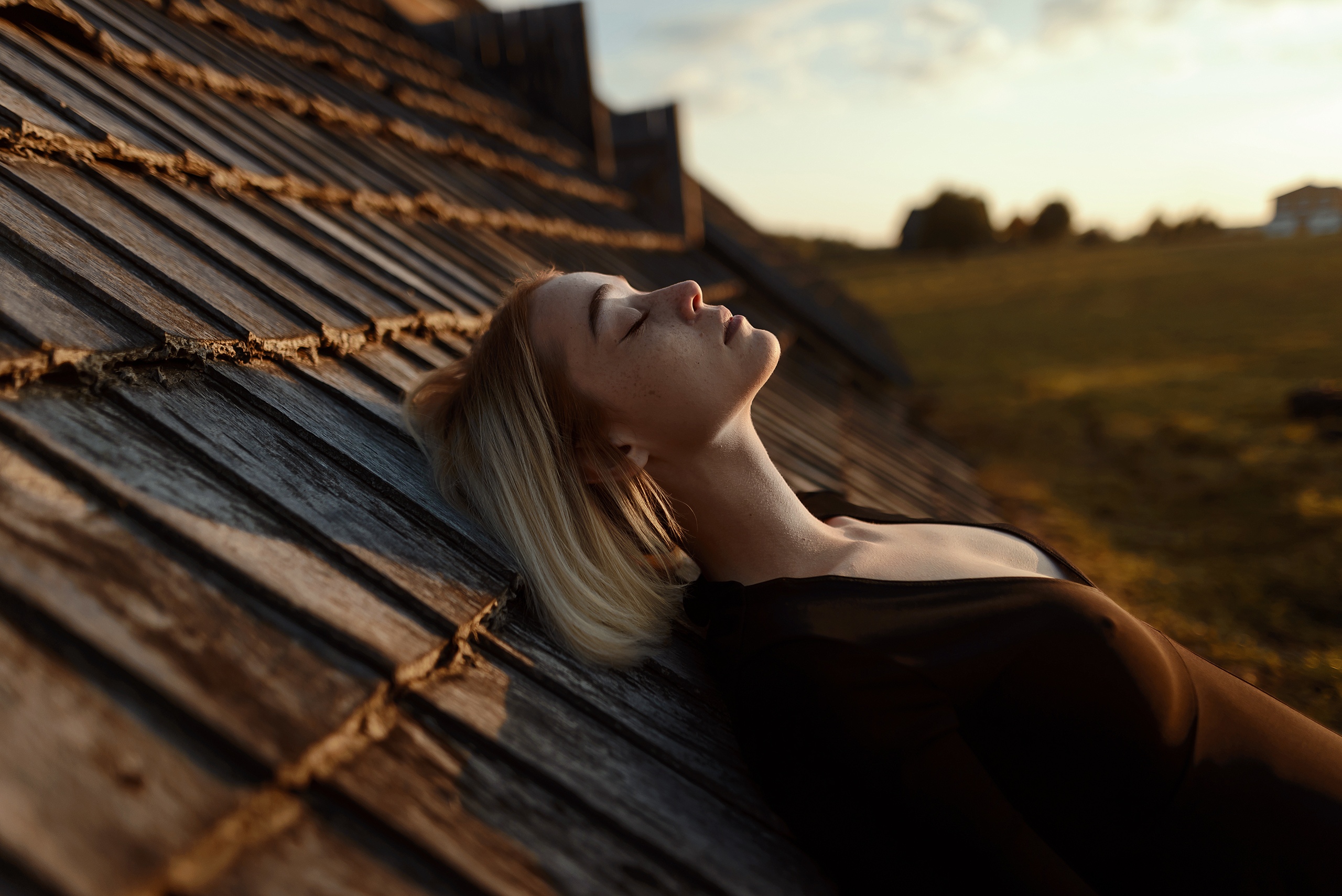 People 2560x1709 women model blonde freckles closed eyes profile dress black dress cleavage lying on back depth of field side view photography outdoors women outdoors Aleks Five Olga Tochyonaya long neck nipples through clothing