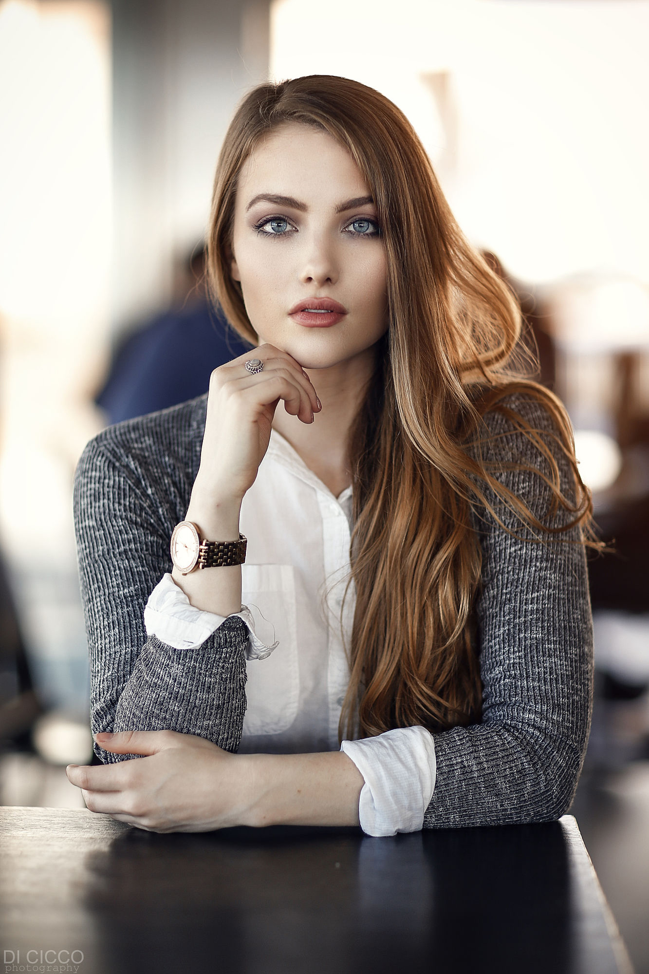 People 1333x2000 women lipstick long hair brunette blouses shirt grey clothing white clothing office watch clocks casual Alessandro Di Cicco table rings touching face April Slough open sweater glamour classy frontal view solo gray eyes wristwatch desk portrait display watermarked