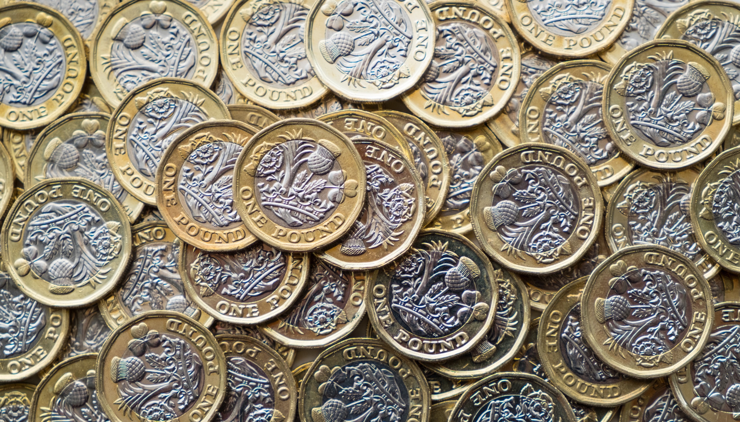General 2560x1459 metal money coins British Pound top view