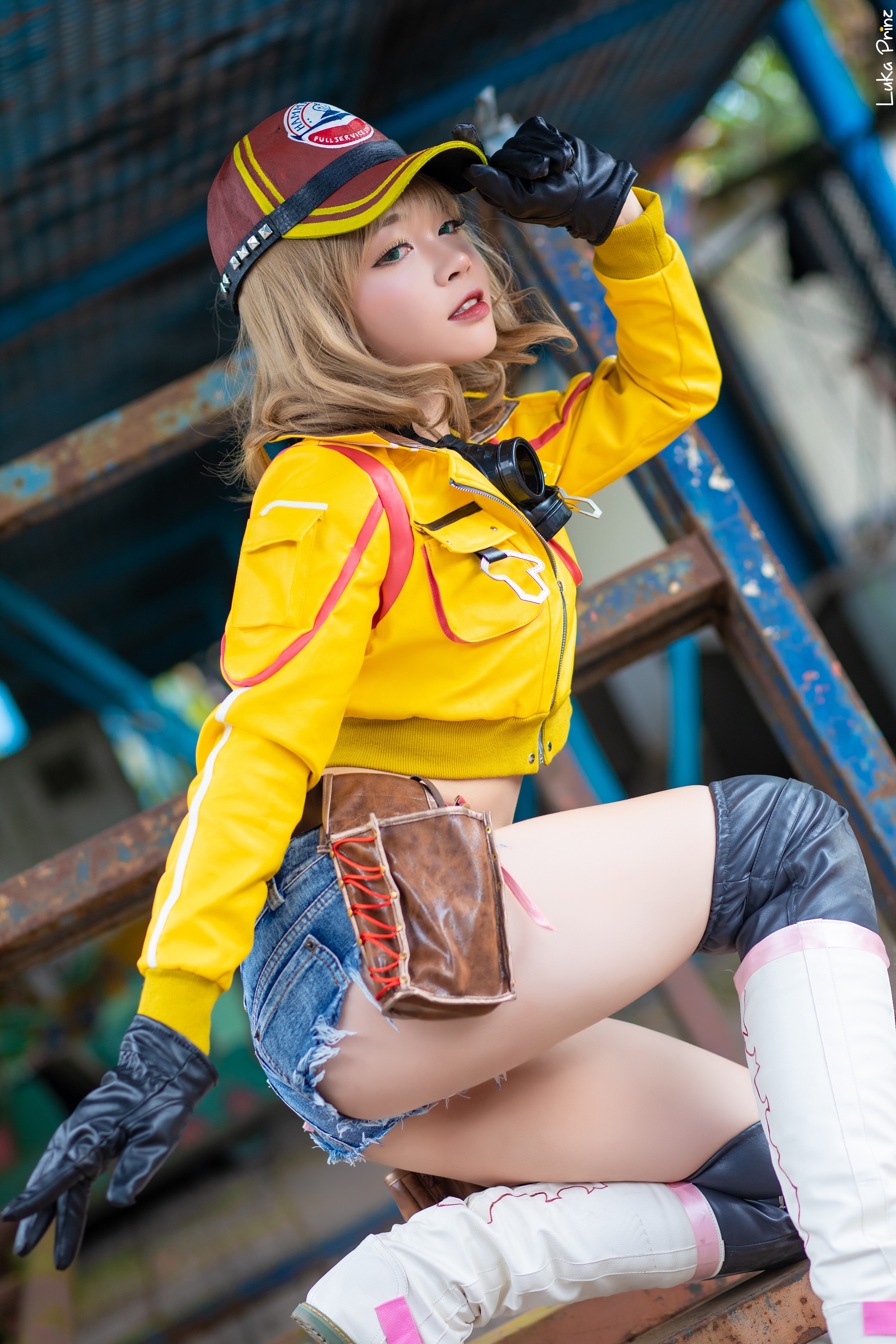 People 2000x3000 women model blonde Asian asian cosplayer cosplay Final Fantasy Final Fantasy XV video games video game characters video game girls baseball cap goggles jacket yellow jacket zipper belly belt jean shorts high waisted shorts denim ass kneeling knee-high boots gloves black gloves green eyes looking at viewer depth of field outdoors women outdoors side view portrait display Cindy Aurum