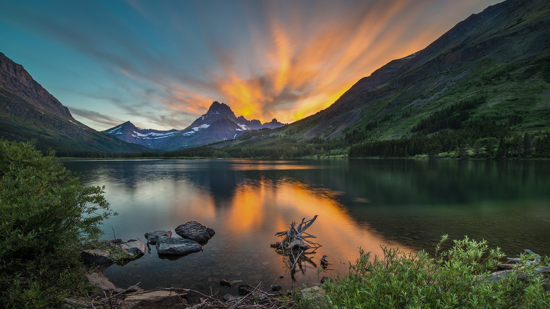 General 1920x1080 nature landscape clouds sky sunset water rocks plants trees lake mountains Swiftcurrent Lake Glacier National Park Montana USA