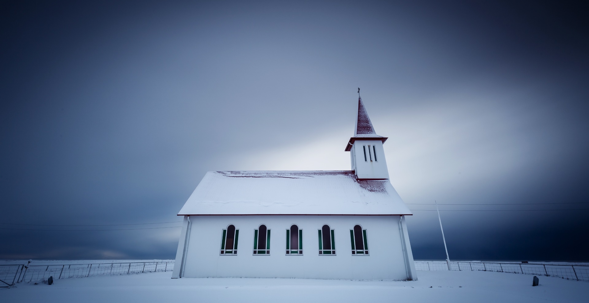 General 1920x990 church building Iceland winter overcast snow