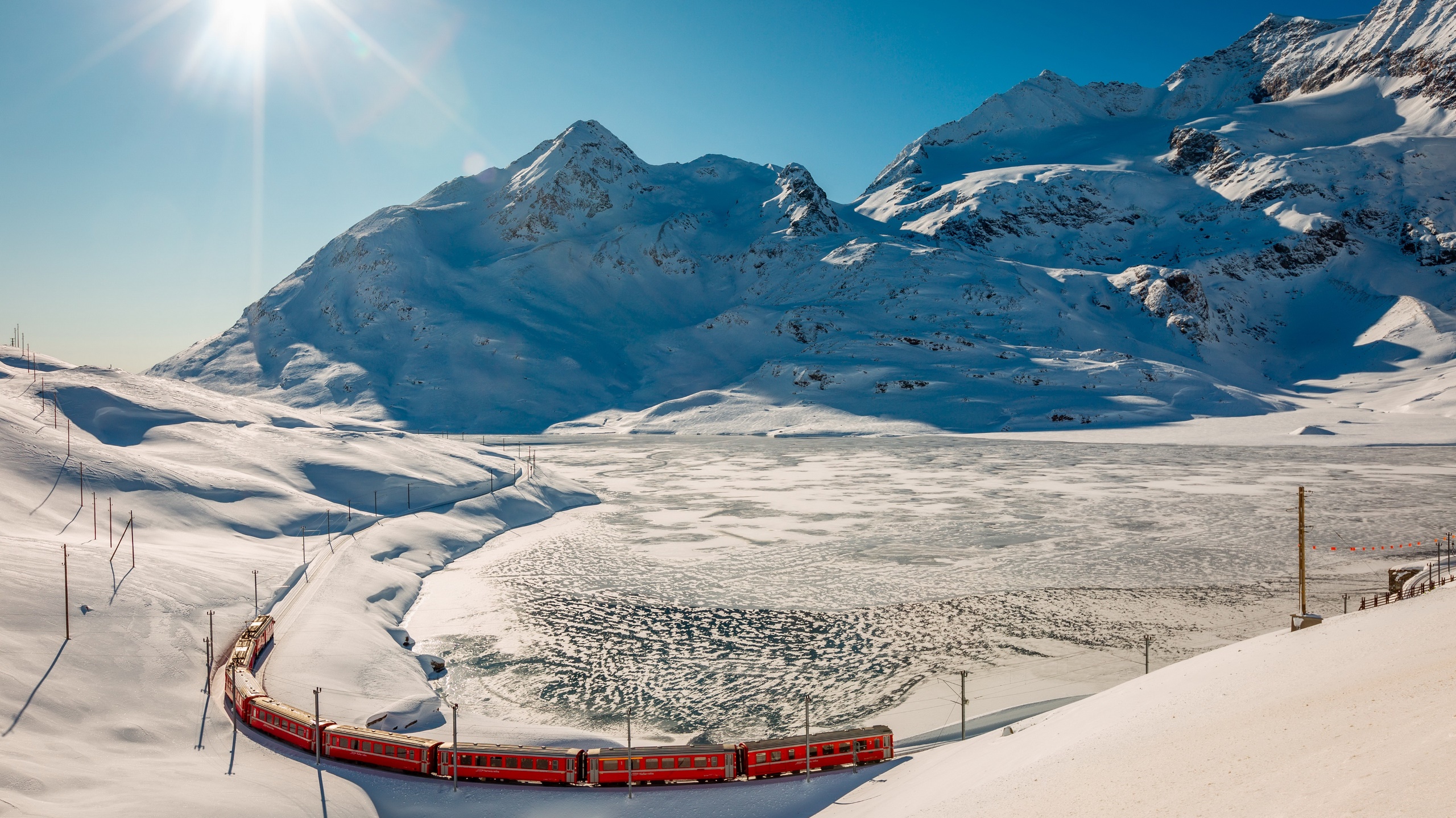 General 2560x1440 Switzerland train vehicle mountains winter snow railway lake