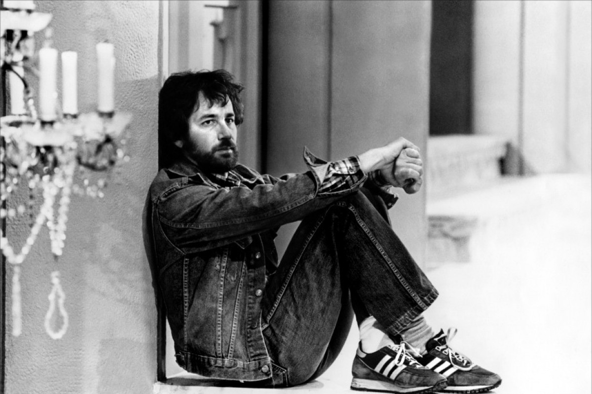 People 1200x799 men Film directors Steven Spielberg jeans monochrome celebrity beard sitting vintage denim jacket on the floor sneakers Adidas looking away alone candles