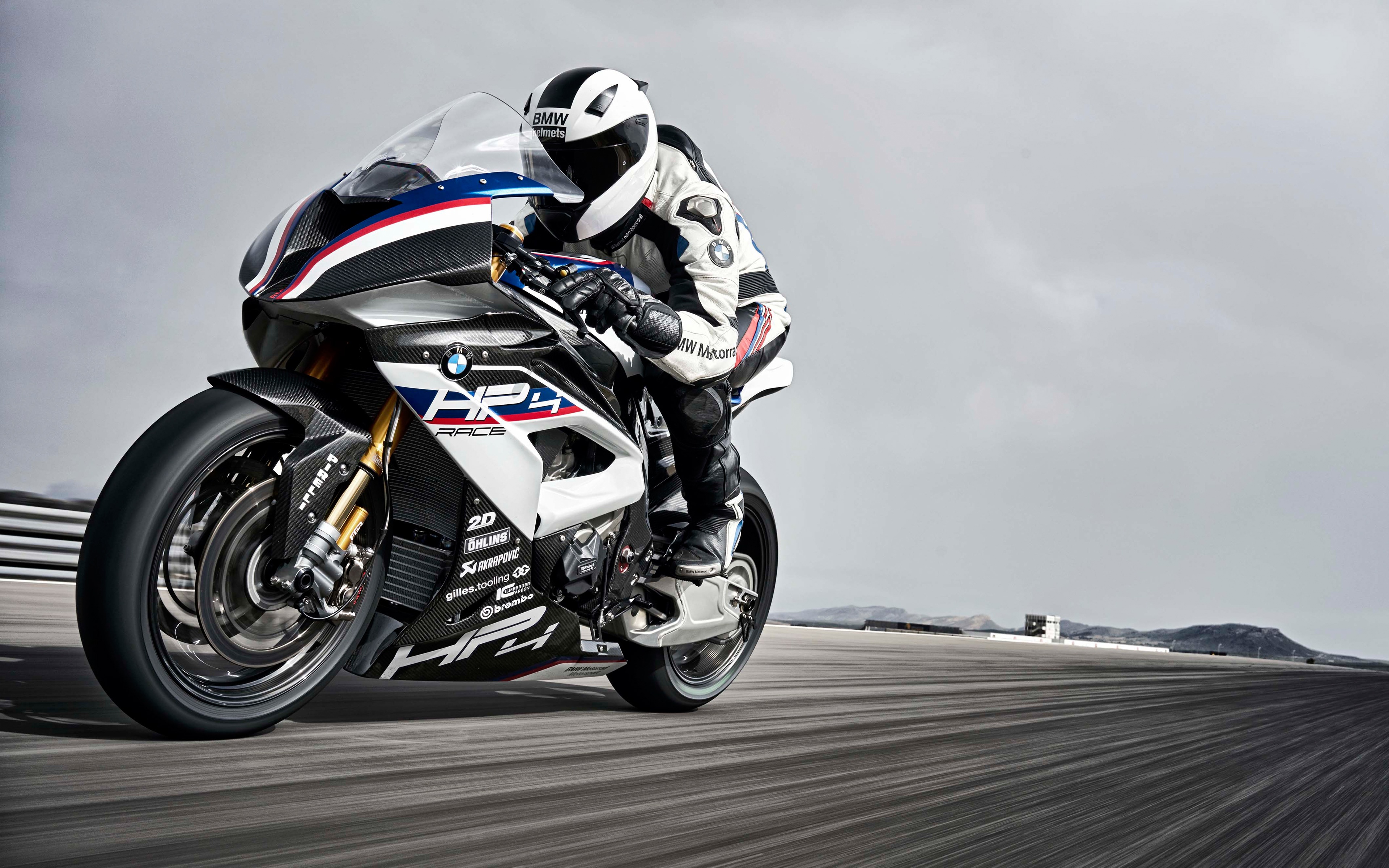 People 3840x2400 motorcycle BMW vehicle asphalt Ohlins Brembo helmet Akrapovic Pirelli racing German motorcyles