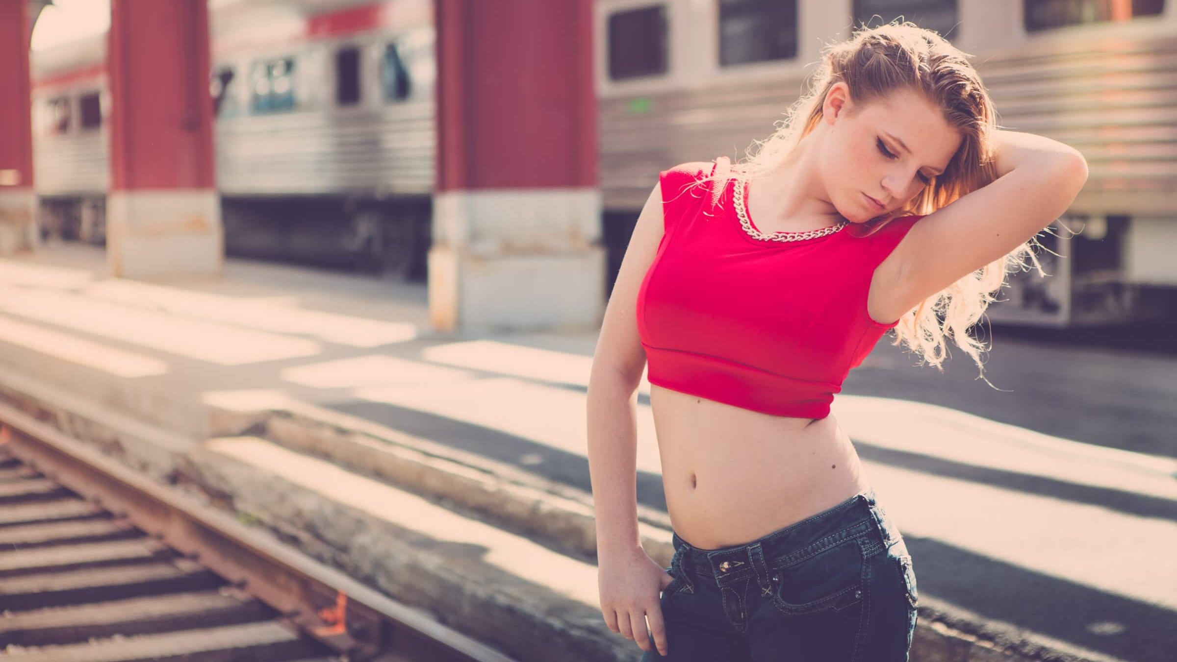 People 2400x1351 red shirt crop top bare midriff belly belly button innie navel low rise jeans jeans depth of field blonde train train station women