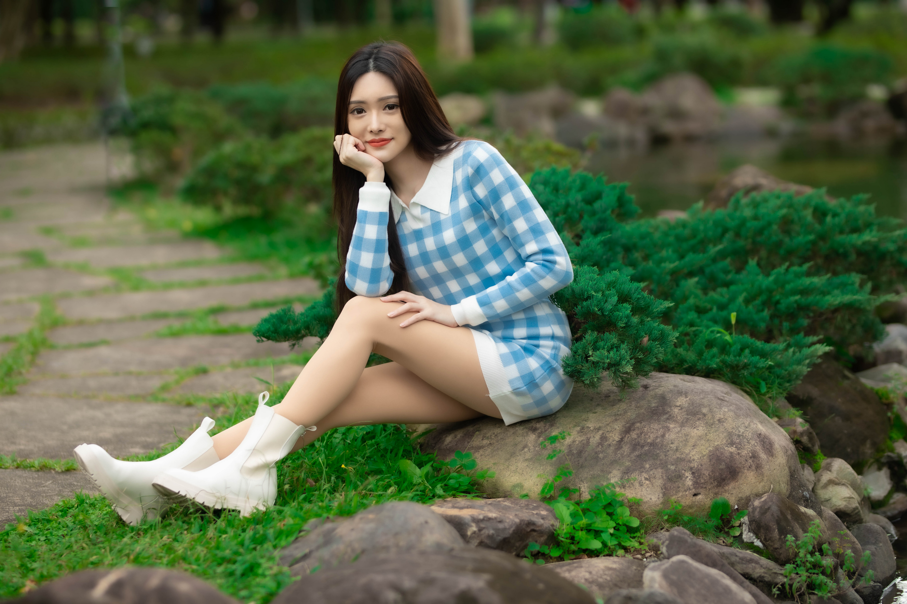 People 3840x2560 Asian model women long hair dark hair depth of field sitting ankle boots grass bushes trees stones minidress looking at viewer