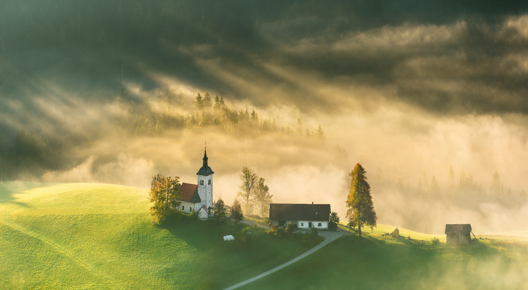 General 1822x1000 Krzysztof Browko landscape sun rays trees mist house top view road Slovenia hills idyllic