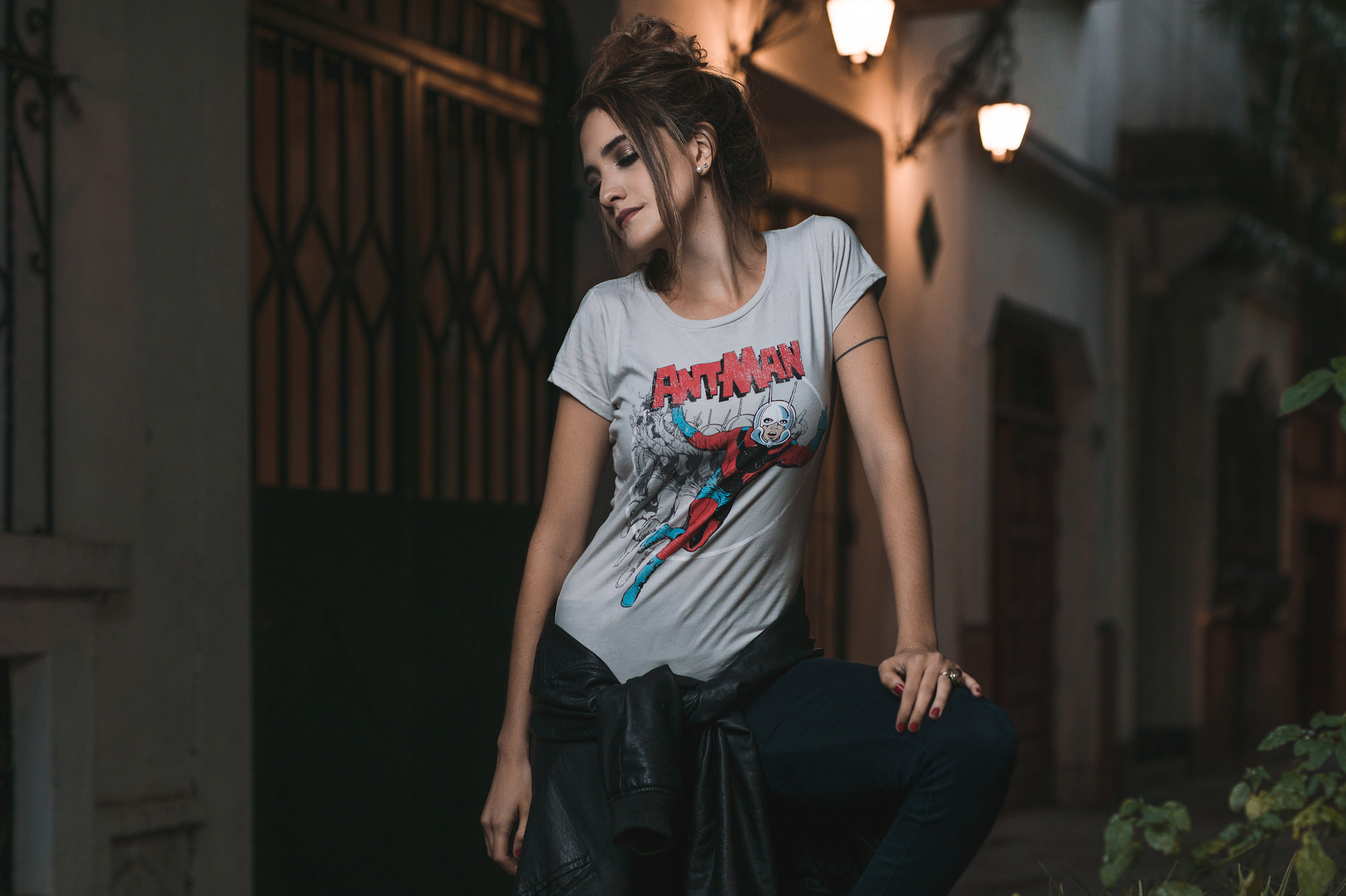 People 2048x1365 women Ant-Man looking below outdoors tied hair white t-shirt leather jacket brunette women outdoors T-shirt jacket photography messy hairbun red nails