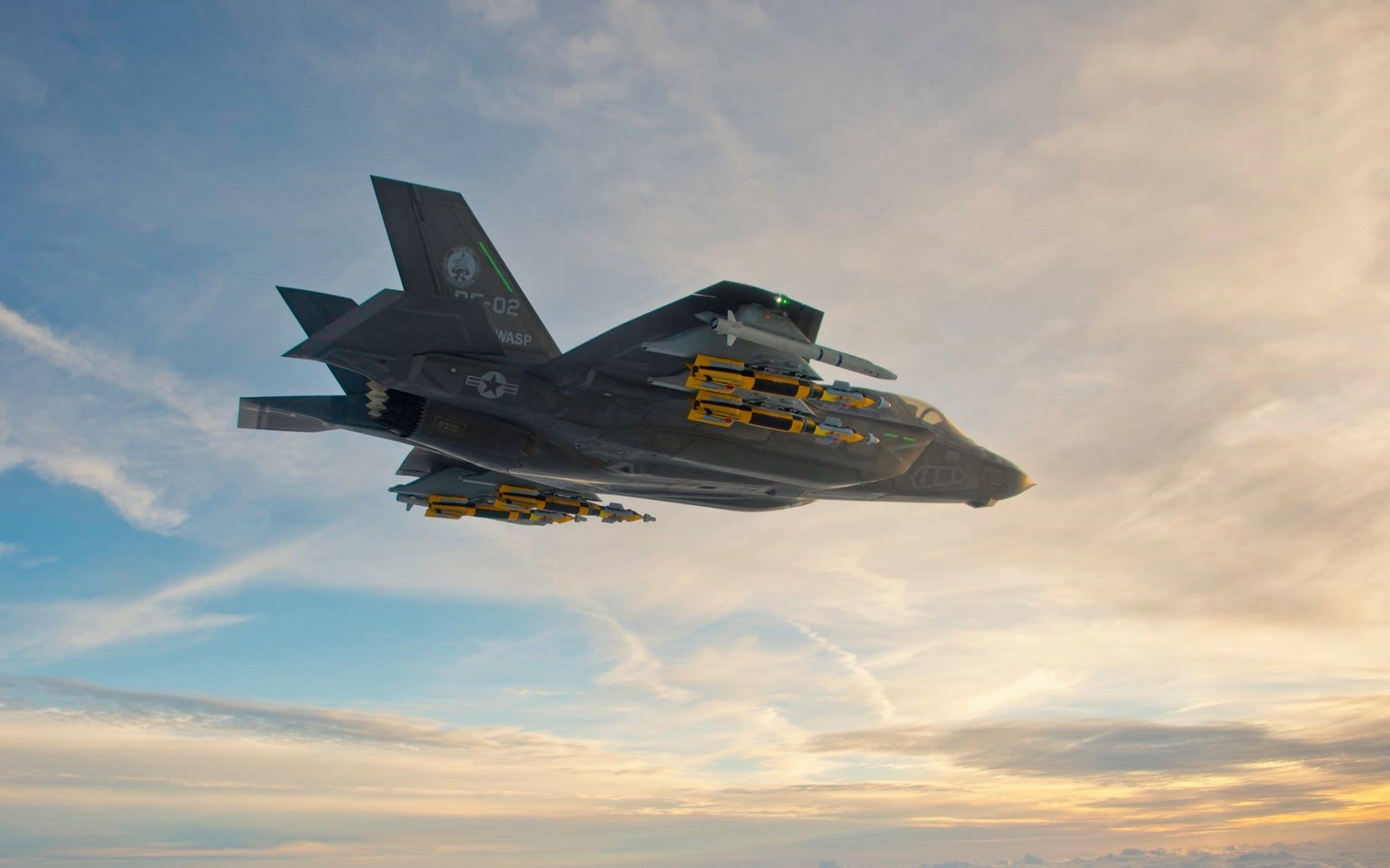 General 1920x1200 aircraft military aircraft Lockheed Martin F-35 Lightning II military vehicle vehicle Lockheed Lockheed Martin military American aircraft sunset sunset glow sky flying clouds orange sky bottom view missiles sunlight