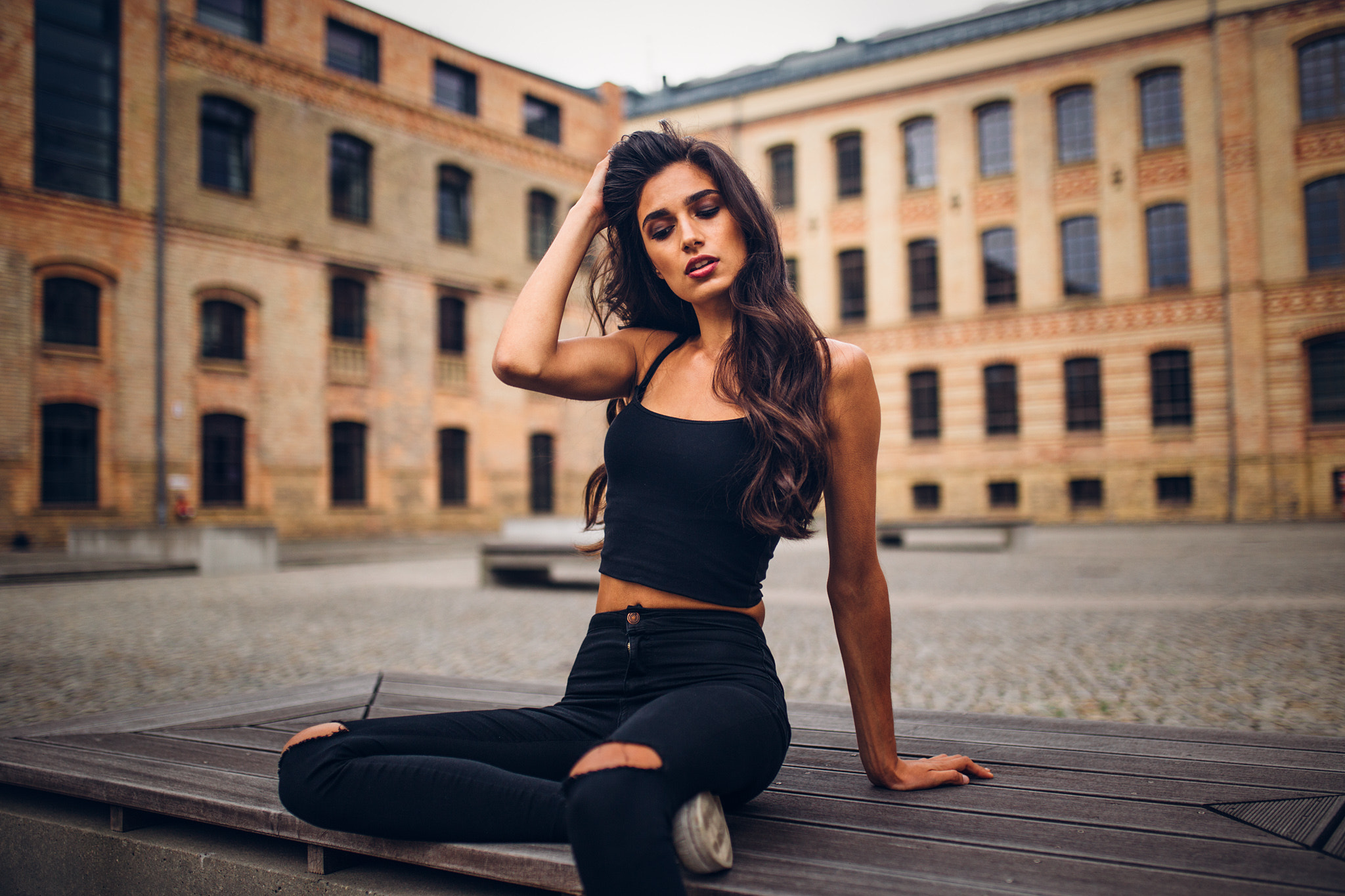 People 2048x1365 women sitting tanned torn jeans depth of field women outdoors black clothing