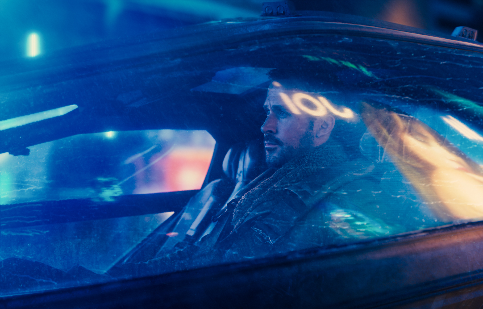 People 2048x1310 Blade Runner 2049 movies men actor blue closeup Ryan Gosling looking away beard closed mouth sitting car car seat