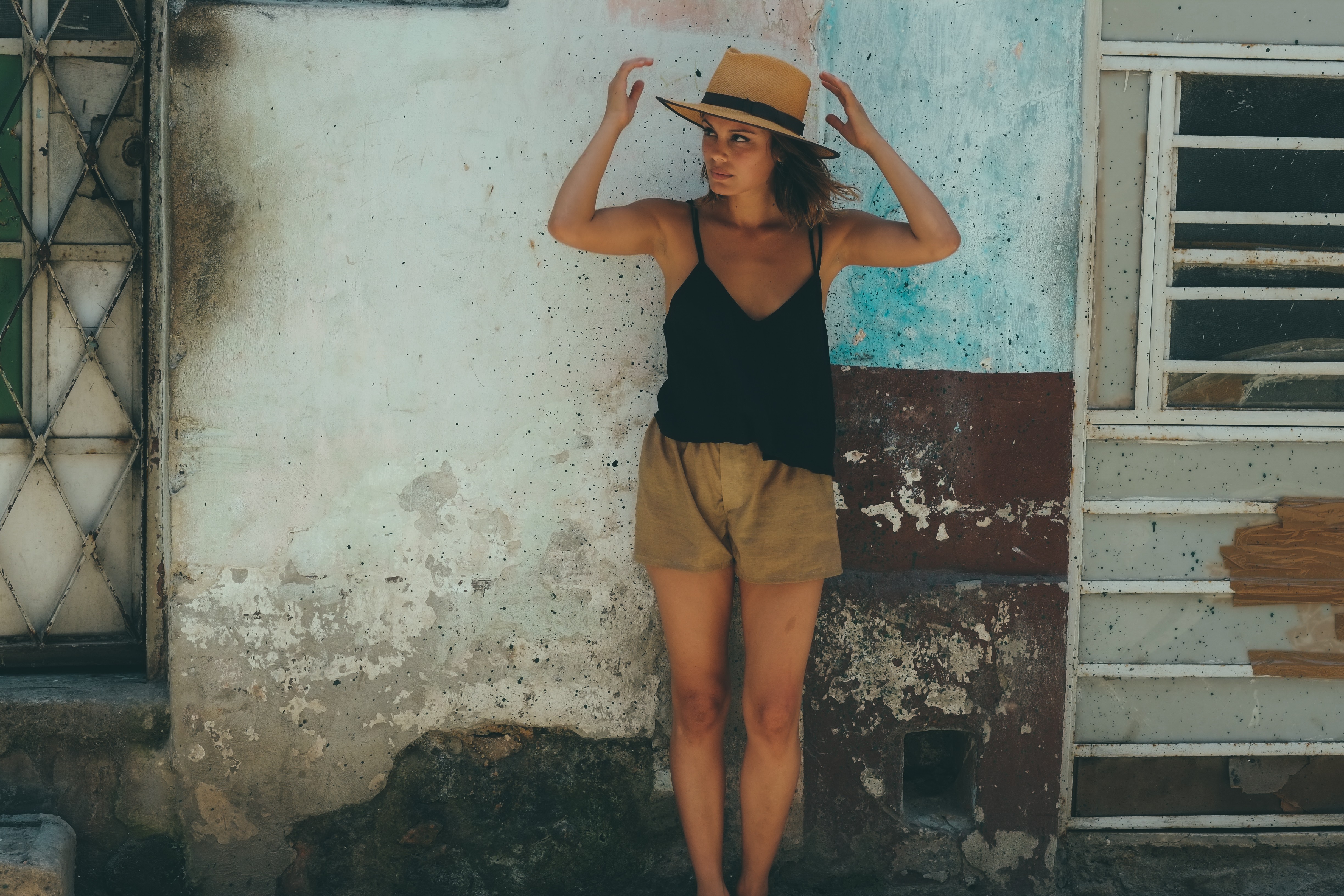 People 4896x3264 Nathalie Kelley  camisole shorts standing hat millinery women arms up looking away wall women outdoors women with hats Australian women actress