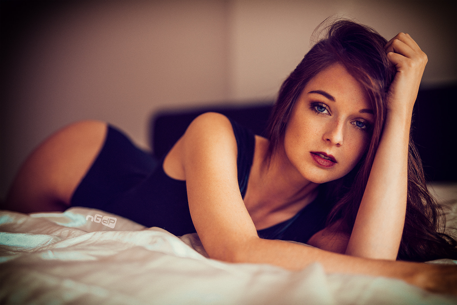 People 1600x1068 women brunette blue eyes hands in hair lying on front bed looking at viewer bodysuit bokeh open mouth red lipstick