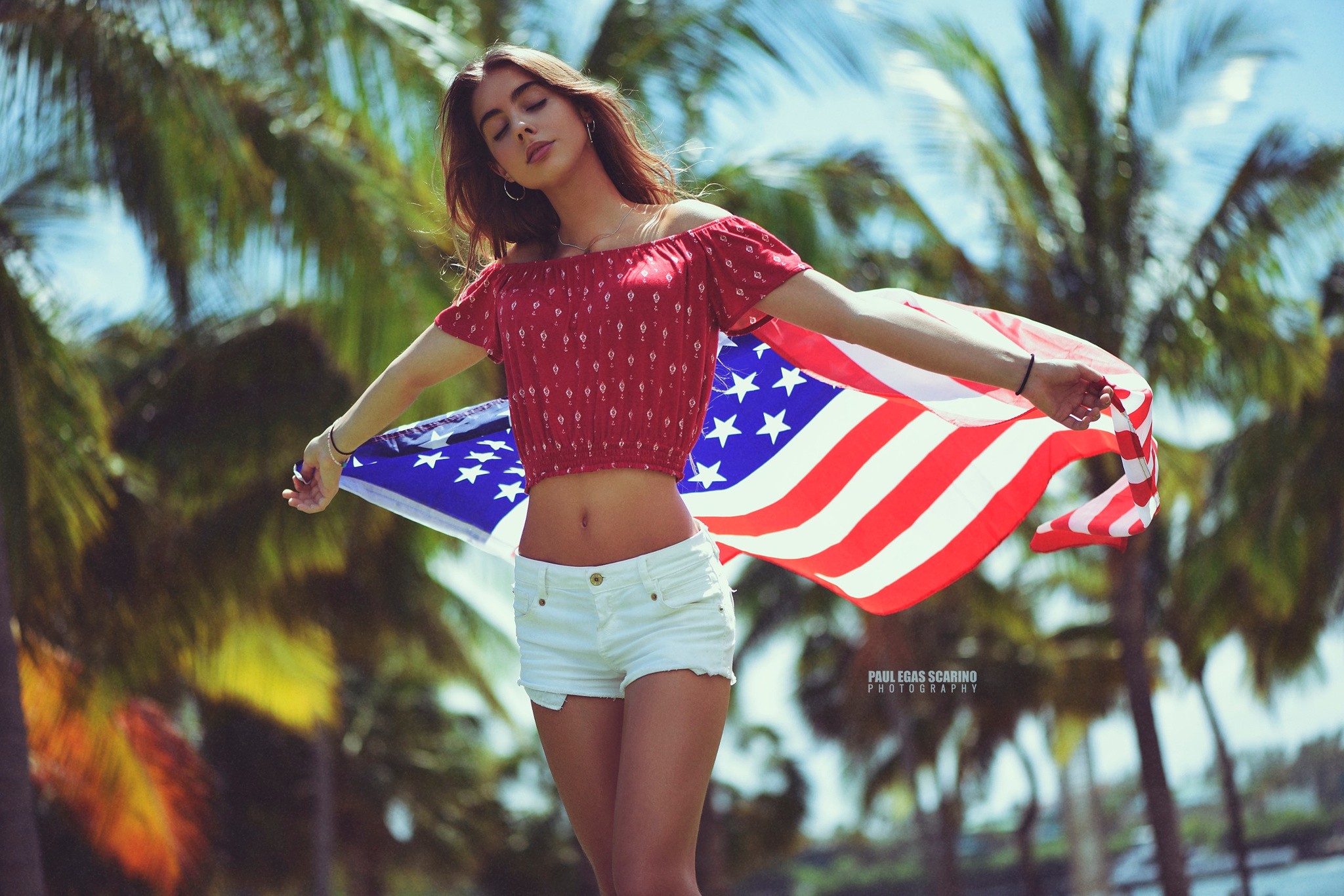 People 2048x1367 Chris Calero women portrait flag closed eyes palm trees jean shorts belly tanned Paul Egas Scarino wristband watermarked