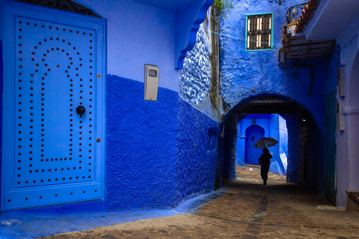 General 1400x935 architecture building old building street door umbrella Chefchaouen Morocco blue arch