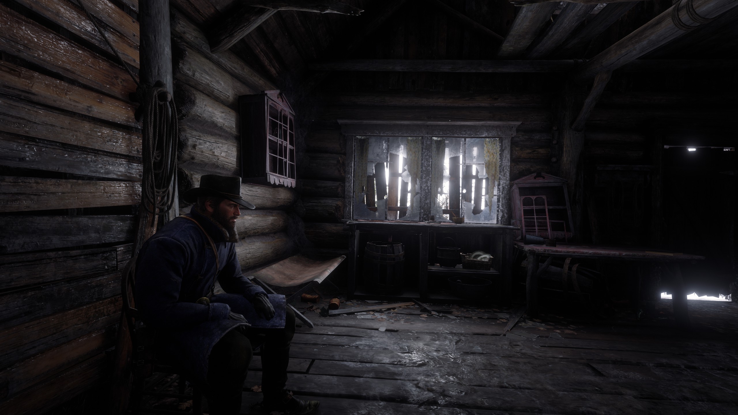 General 2560x1440 Red Dead Redemption 2 video game characters CGI sitting Rockstar Games video game art screen shot cabin Arthur Morgan video games men indoors hat wood beard natural light men with hats video game men messy