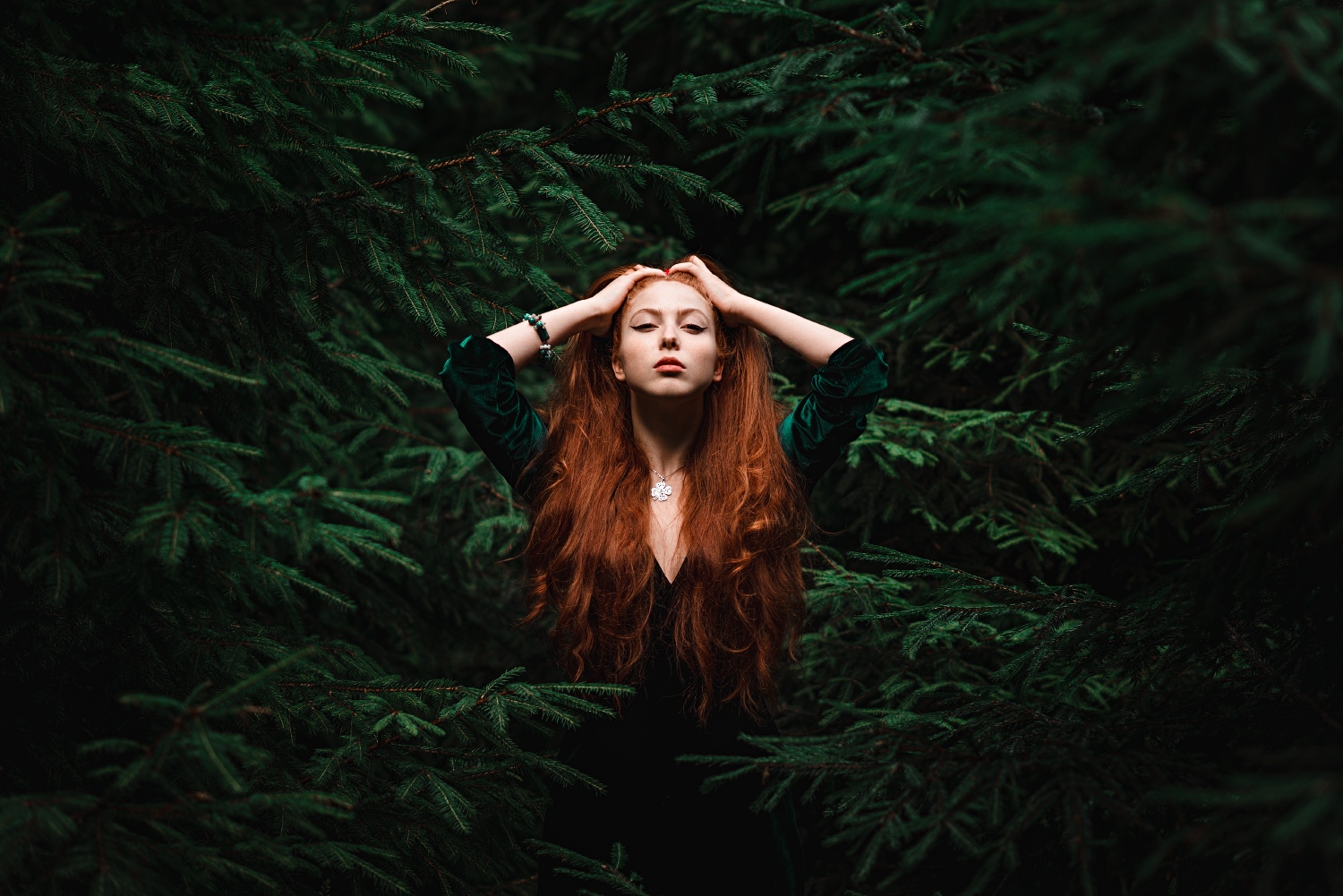 People 1500x1001 women model redhead portrait outdoors looking at viewer forest dress necklace long hair hand(s) on head trees pine trees branch women outdoors