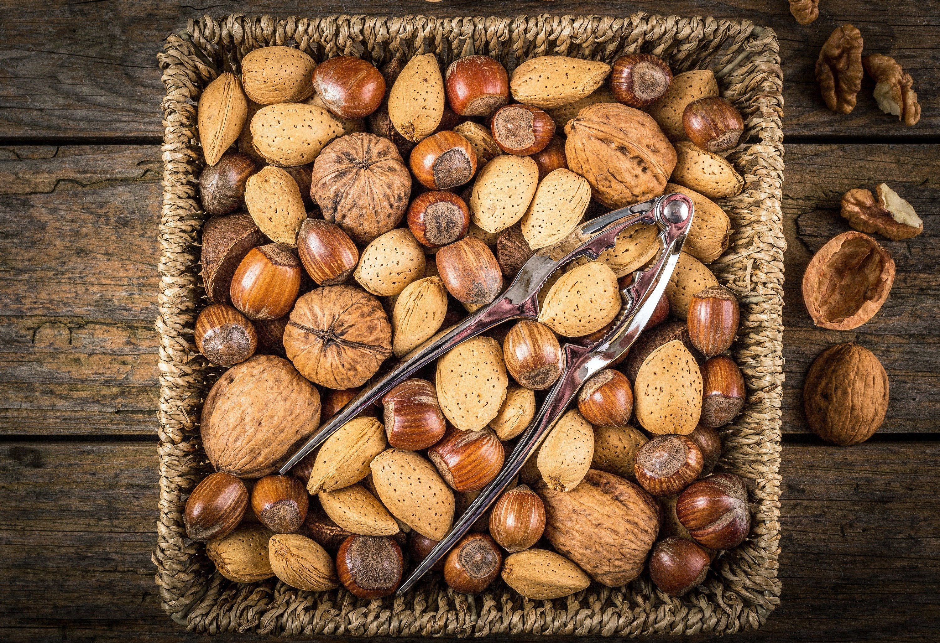 General 3000x2053 nuts food baskets wooden surface walnuts hazelnut closeup nutcracker (tool) tools