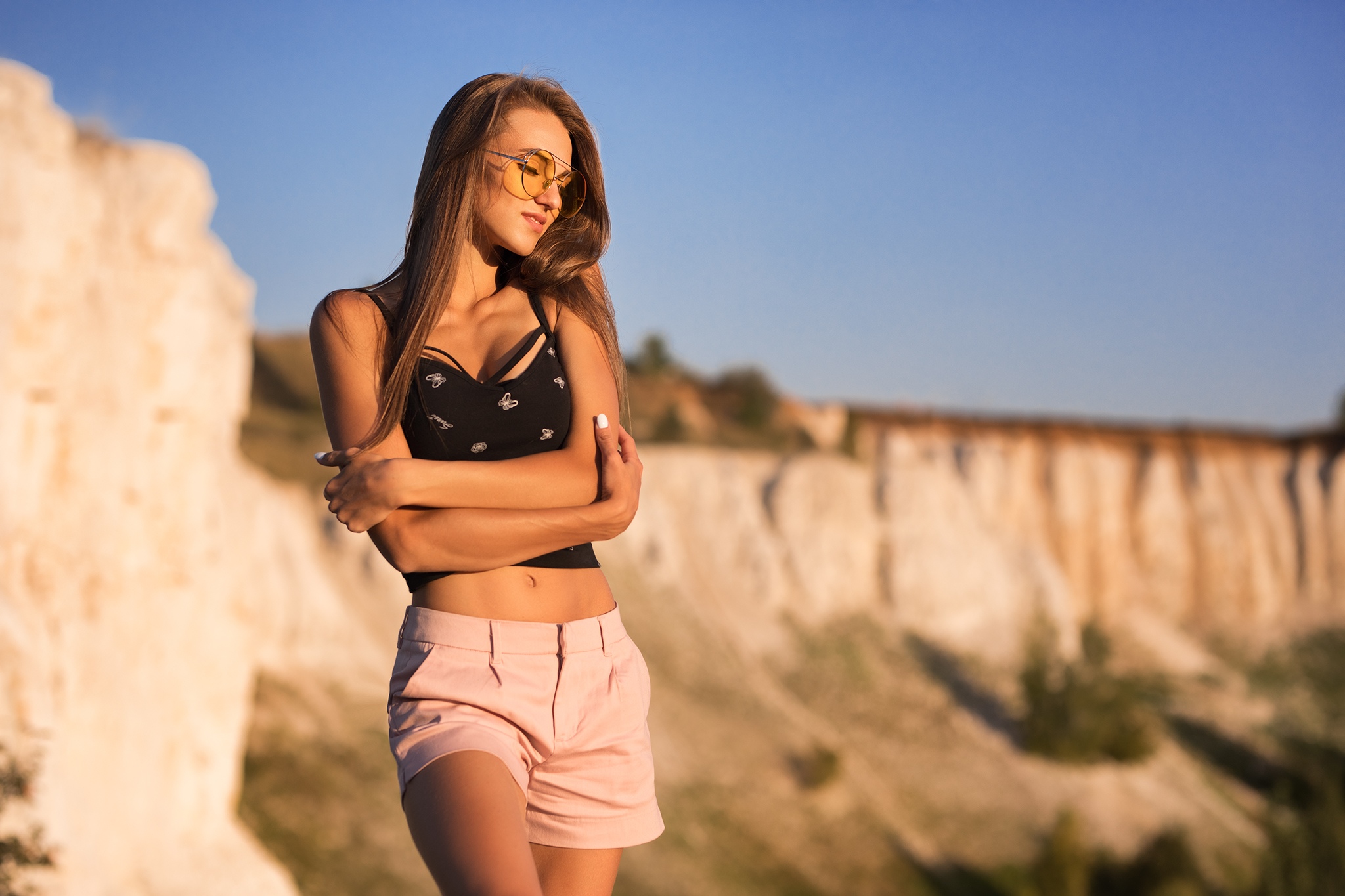 People 2048x1365 Margarita Chelnokova women model brunette long hair closed eyes smiling sunglasses outdoors portrait black top arms crossed belly painted nails Dmitry Shulgin crop top bare midriff belly button pink shorts shorts