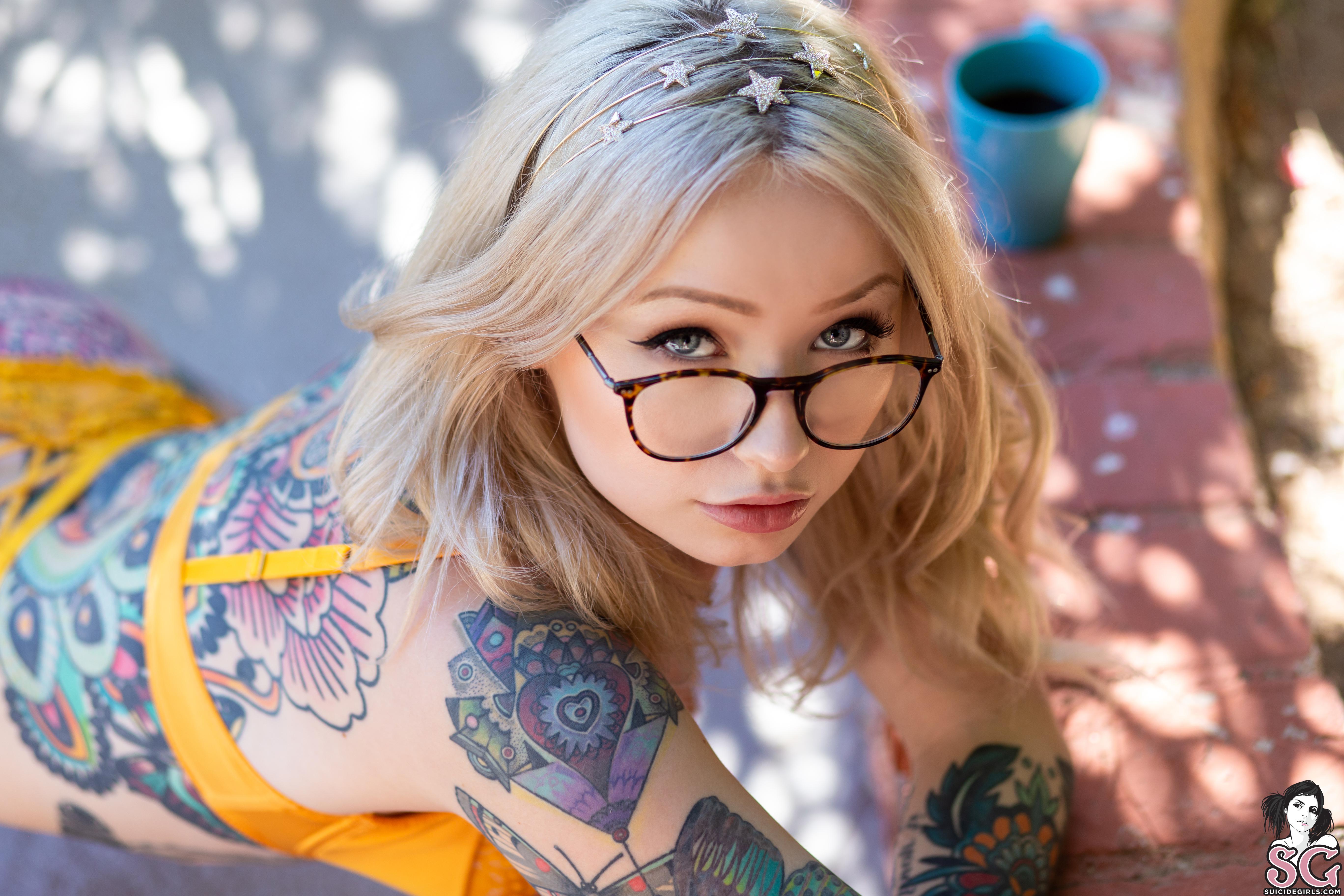 Blonde glasses tattoo