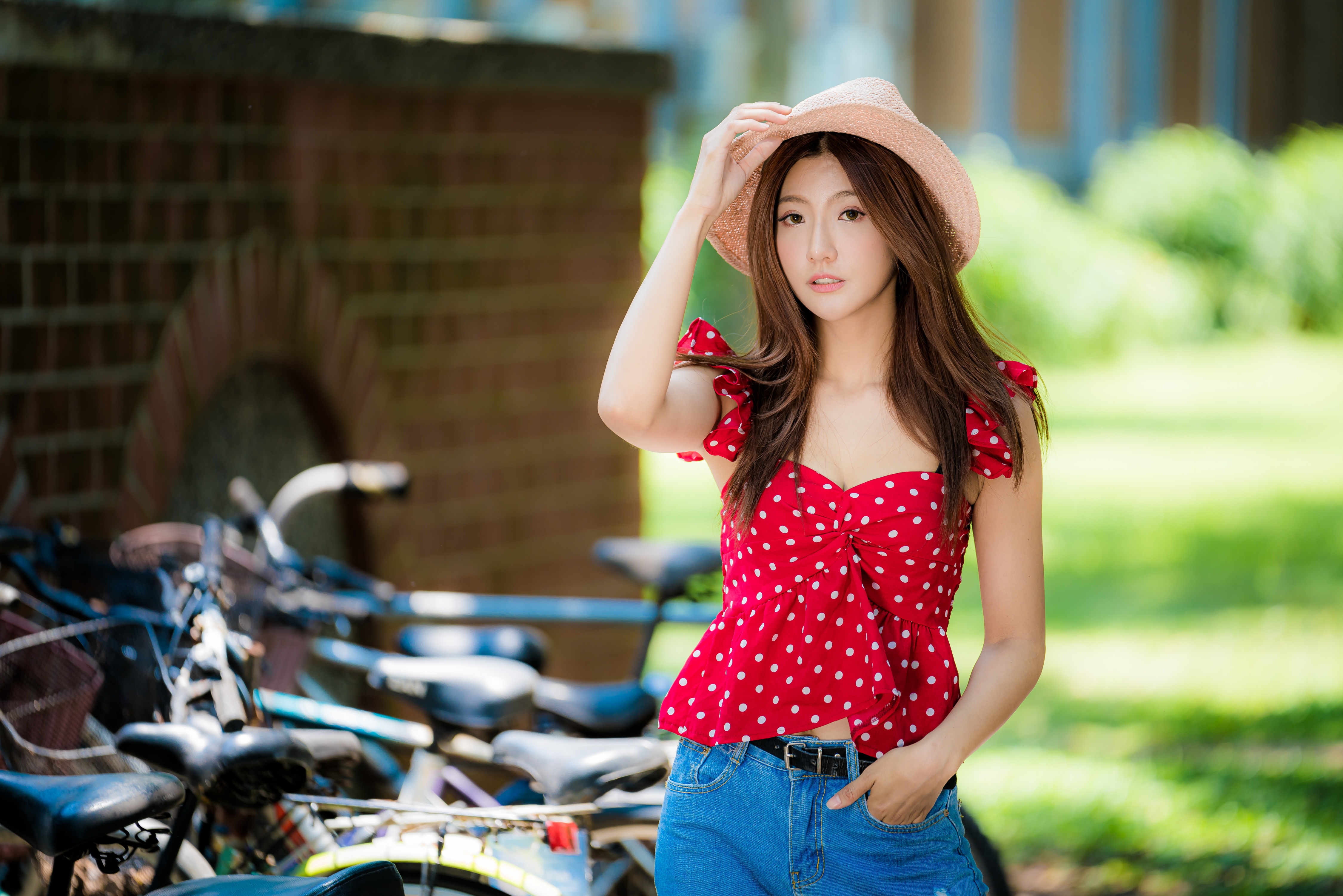 People 4500x3002 Asian women model long hair depth of field brunette jeans blouses straw hat polka dots bicycle