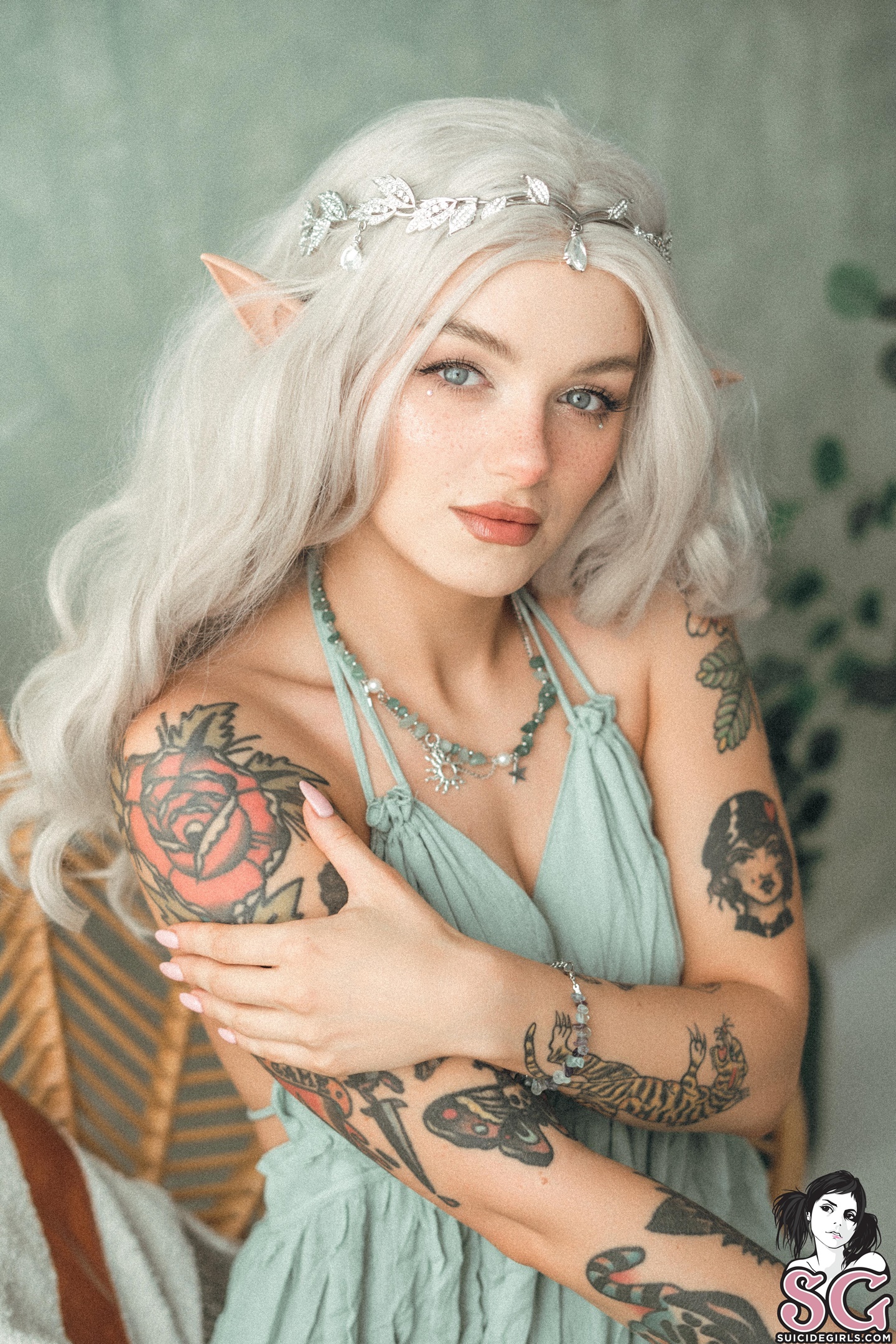 People 1440x2160 Jeany Kicz Suicide Girls portrait display women blonde model tattoo inked girls blue eyes Polish pointy ears face bokeh bare shoulders necklace looking at viewer freckles women indoors watermarked