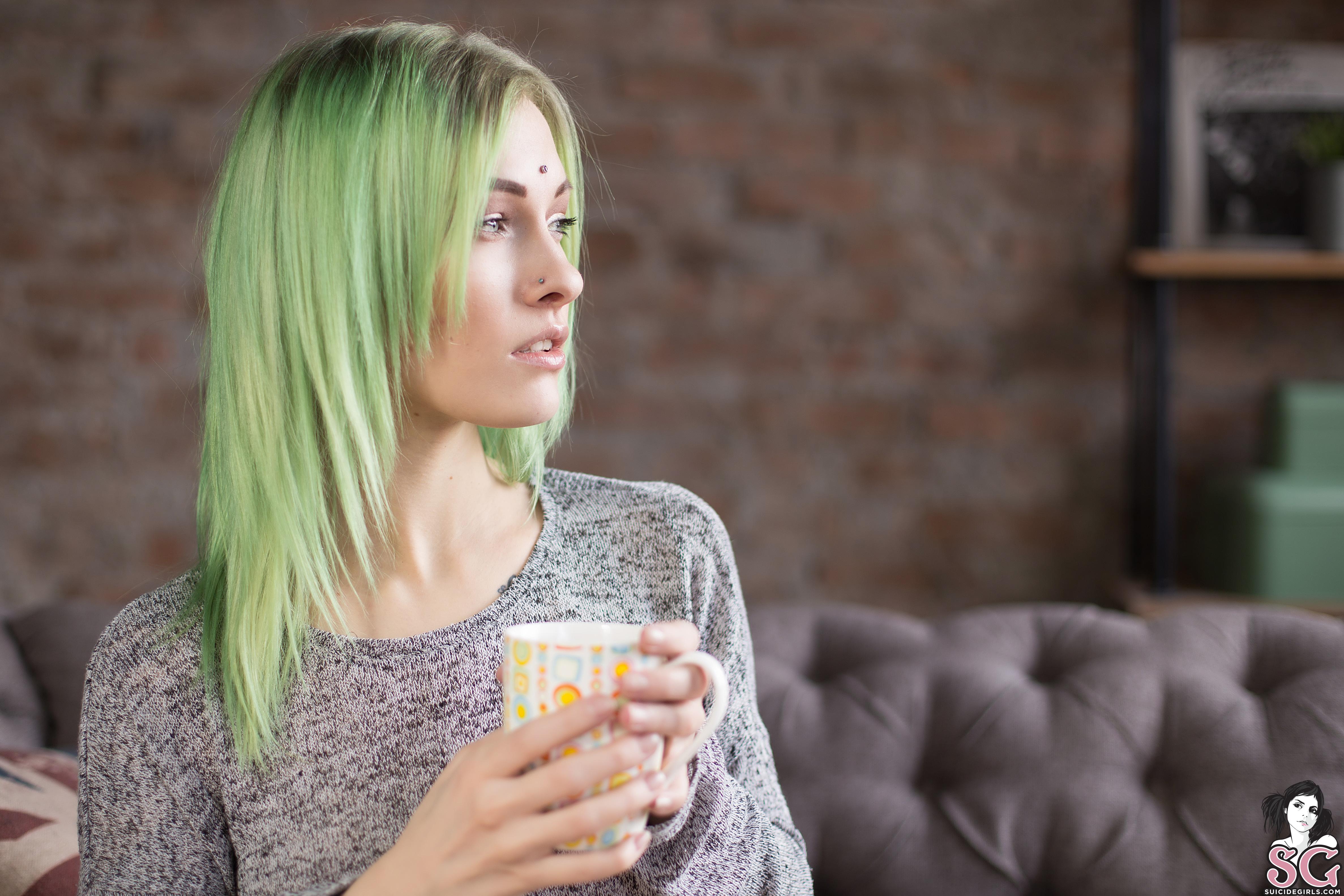 People 4748x3165 women model Suicide Girls dyed hair Sasha Brink green hair sweater couch cup looking away depth of field piercing women indoors
