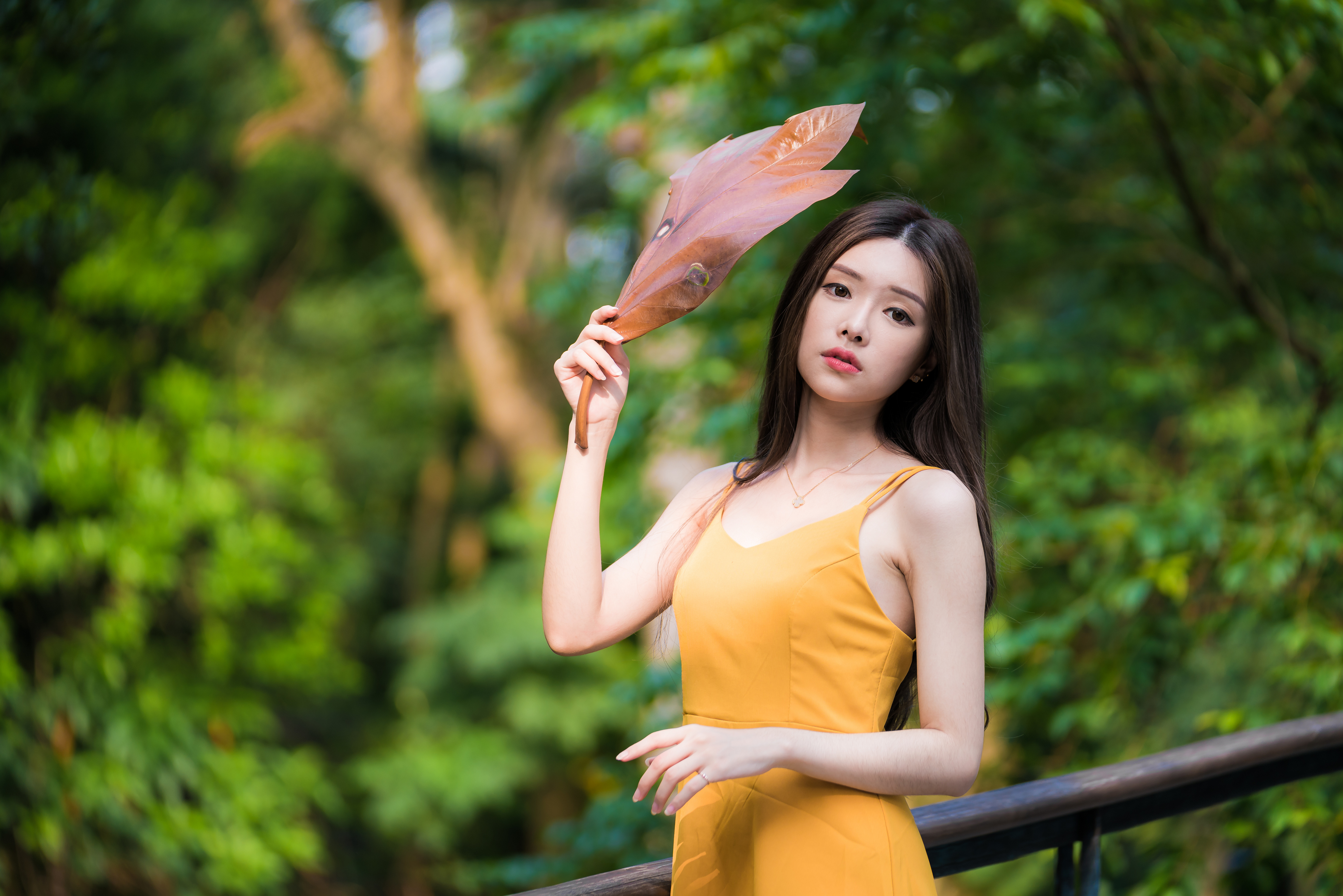 People 4500x3002 Asian model women long hair dark hair depth of field yellow dress leaves necklace looking at viewer bushes