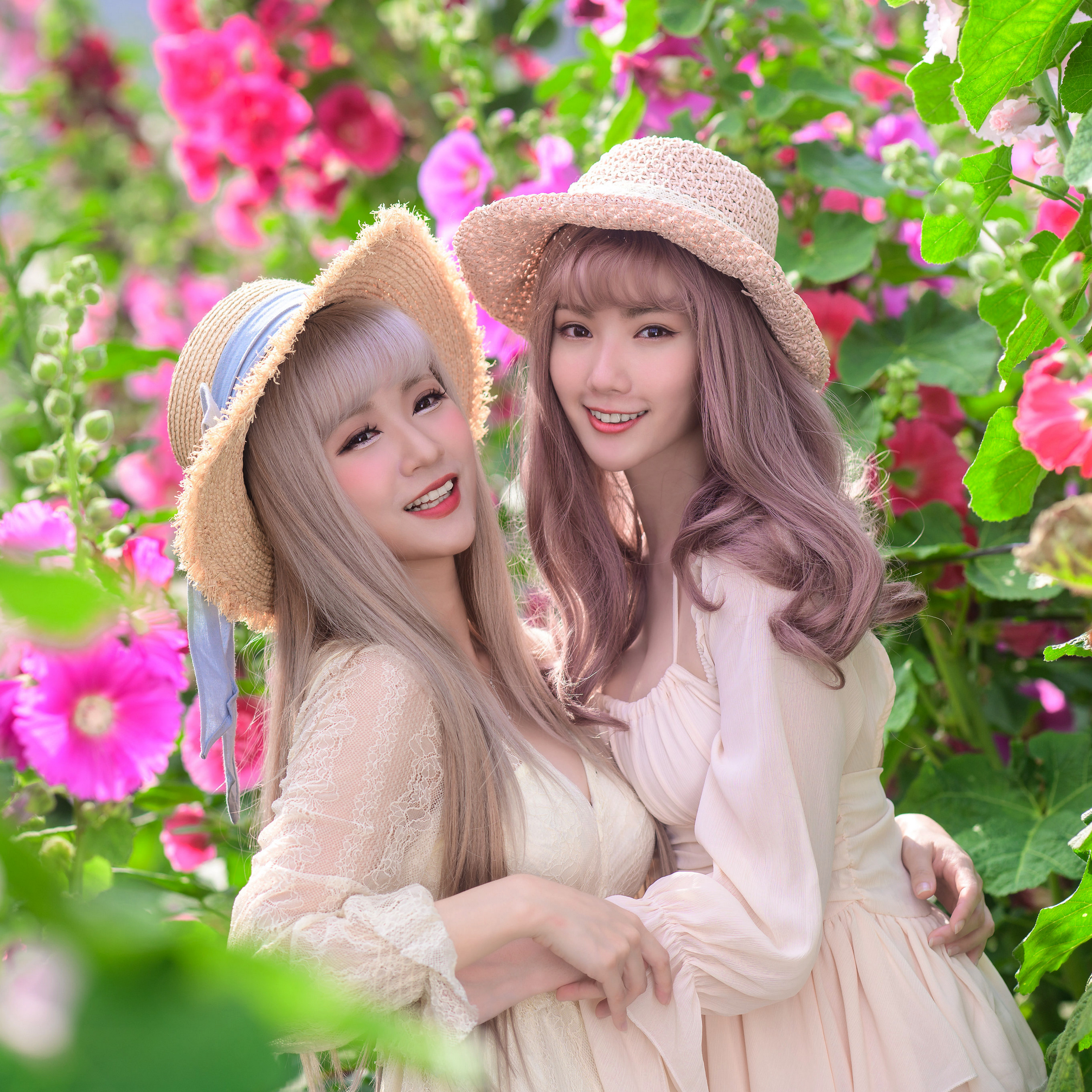 People 2560x2560 Asian model women long hair dyed hair straw hat two women women outdoors flowers dress hugging looking at viewer depth of field field