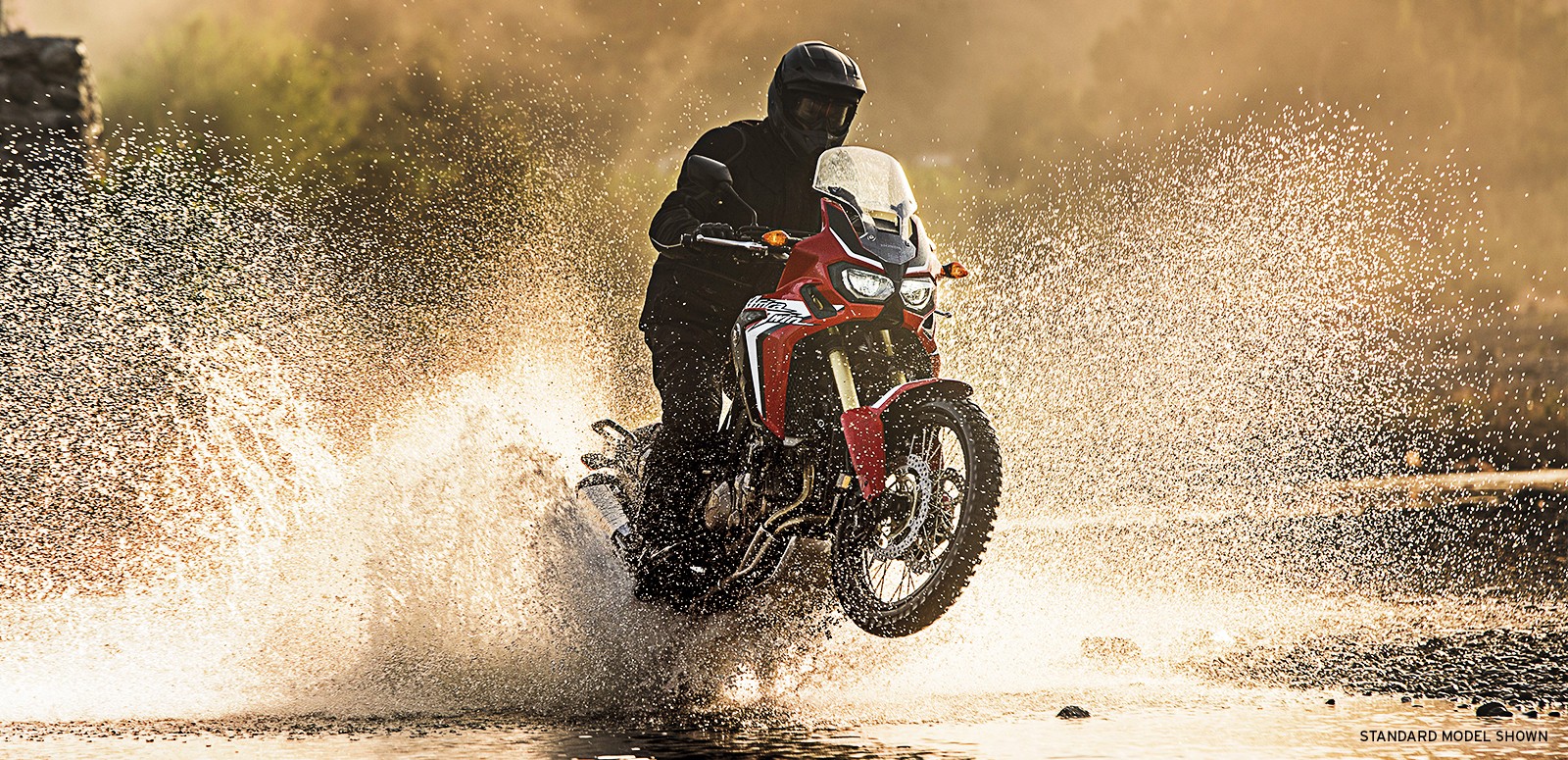 People 1600x775 Honda Africa Twin motorcycle water splashes