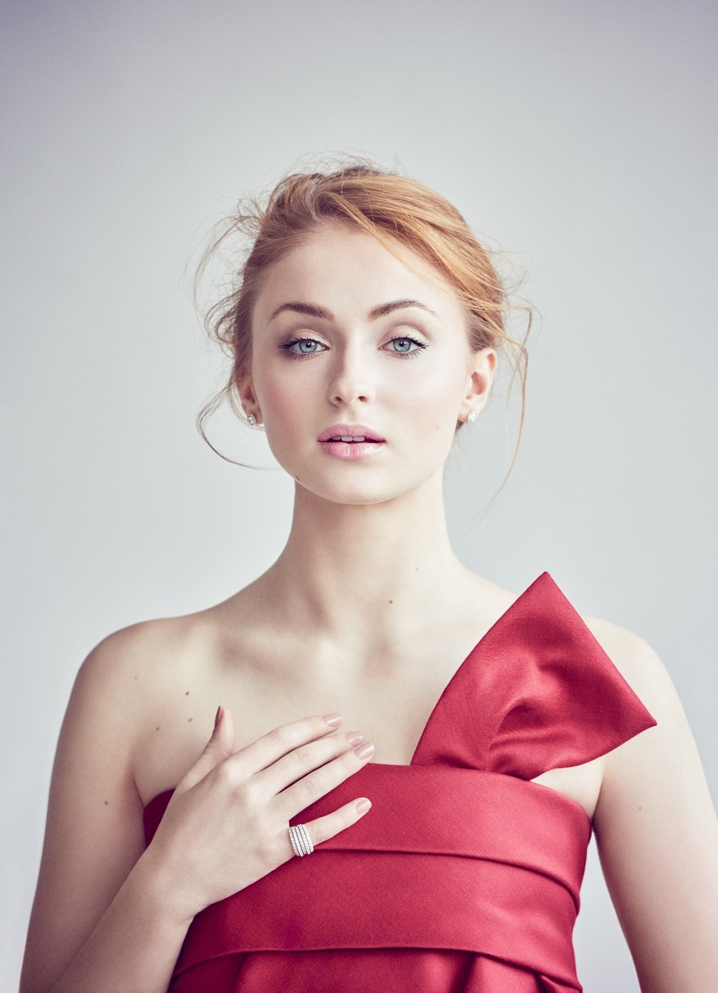 People 1041x1440 actress women Sophie Turner looking at viewer portrait display brunette bare shoulders hands portrait model red dress strapless dress redhead blue eyes British women women indoors indoors red clothing makeup pink lipstick gray background face