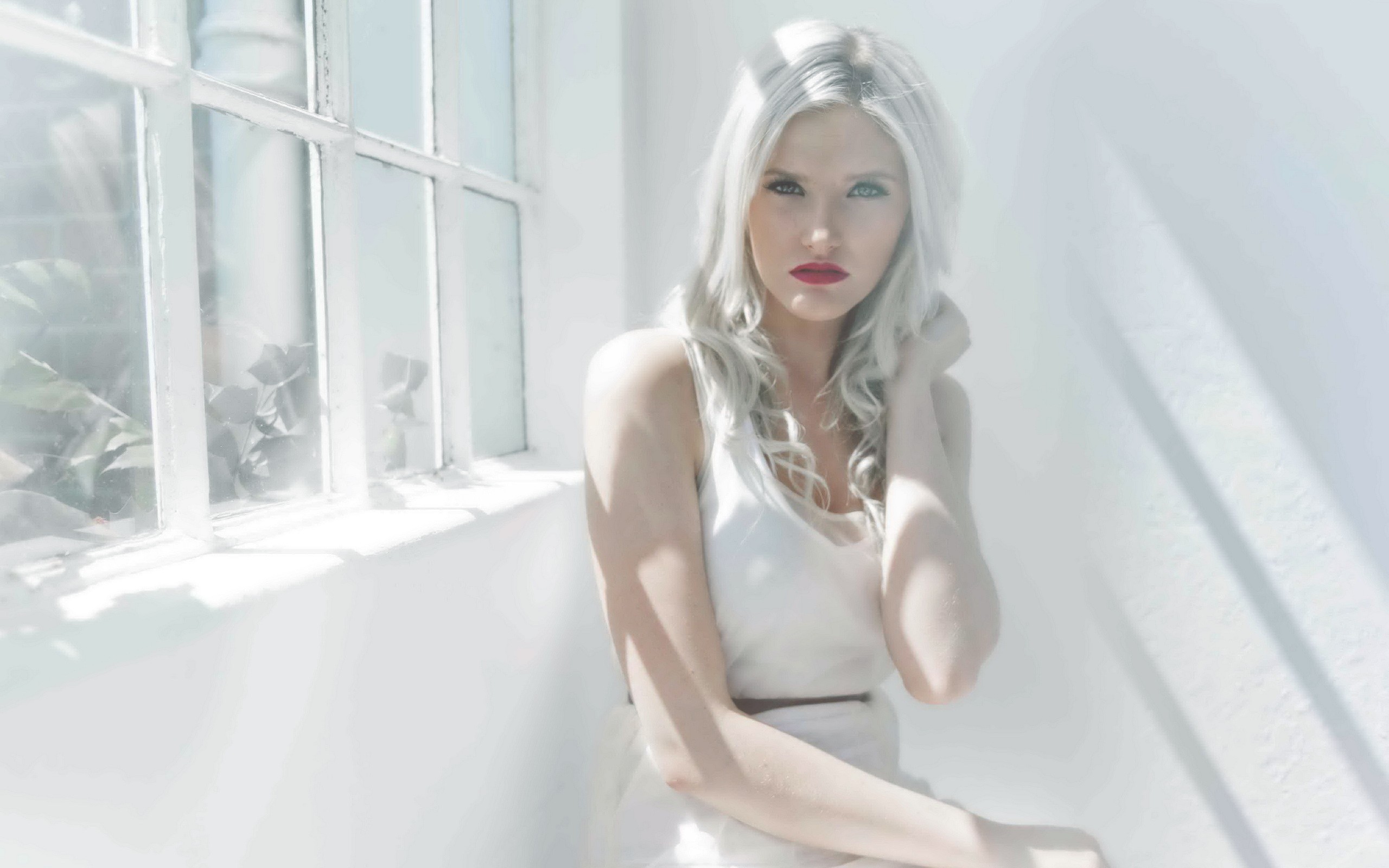 People 2560x1600 window platinum blonde women model white looking at viewer women indoors indoors by the window makeup white hair white clothing red lipstick sitting long hair