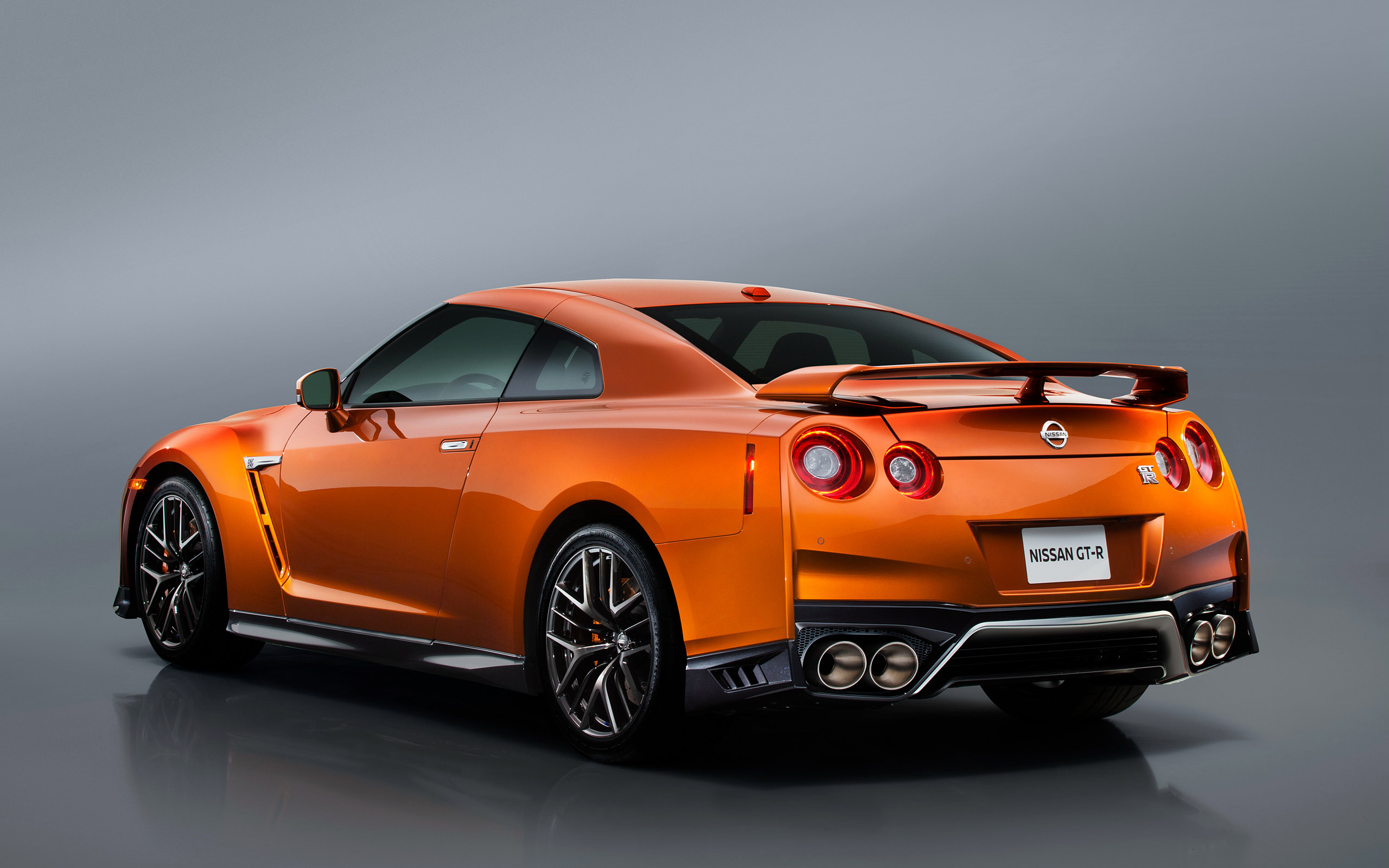 General 2560x1600 Nissan GT-R car vehicle simple background reflection orange cars Nissan gray background Japanese cars rear view licence plates minimalism