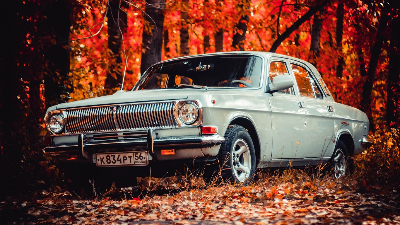 General 1366x768 car vehicle fall leaves trees Russian cars GAZ-24 Volga forest GAZ old car silver cars numbers Russia