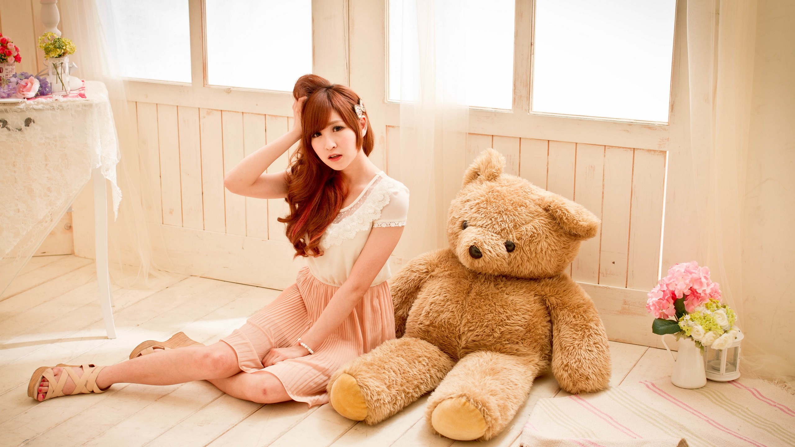 People 2560x1440 teddy bears Asian women model women indoors indoors painted toenails plush toy dyed hair long hair redhead sitting on the floor looking at viewer