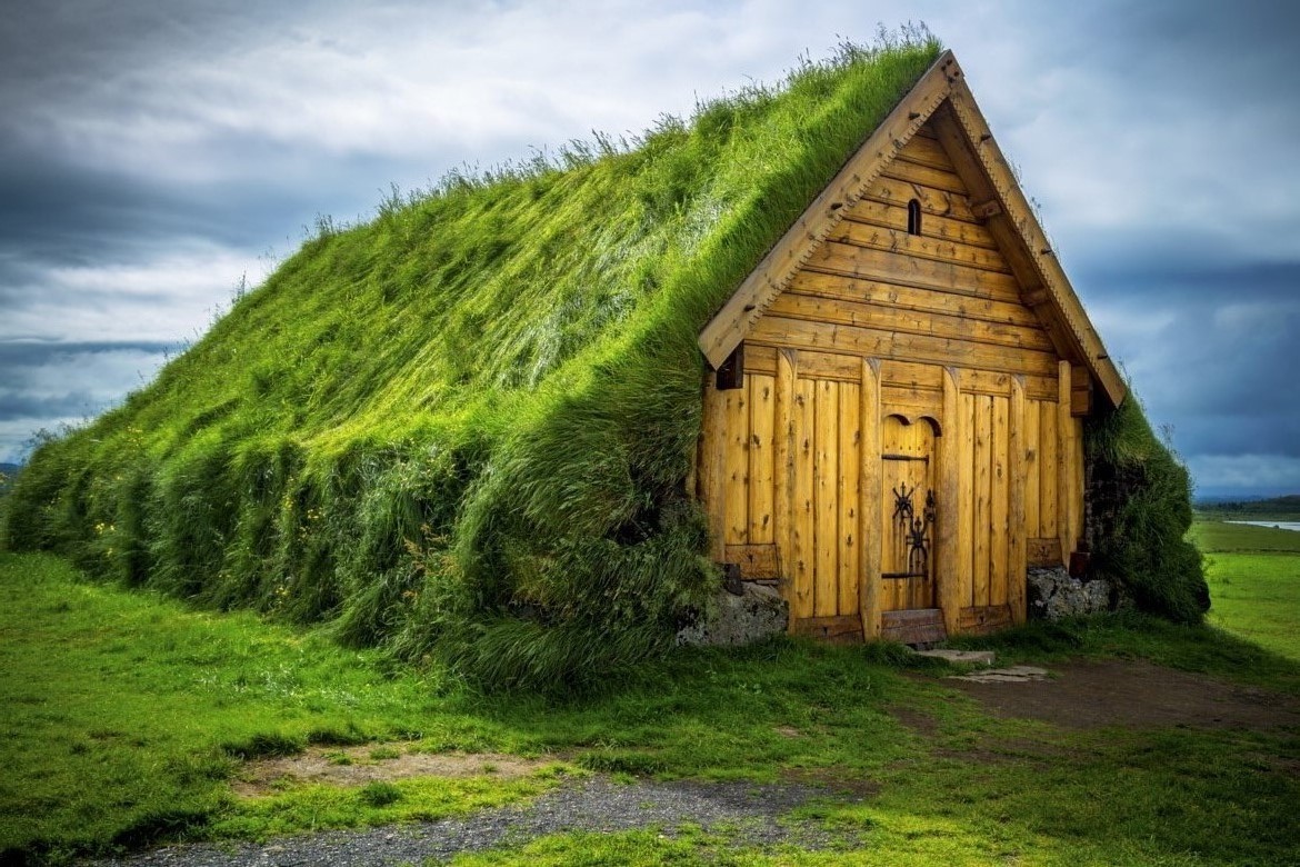 General 1170x780 house field Iceland clouds wood planks grass