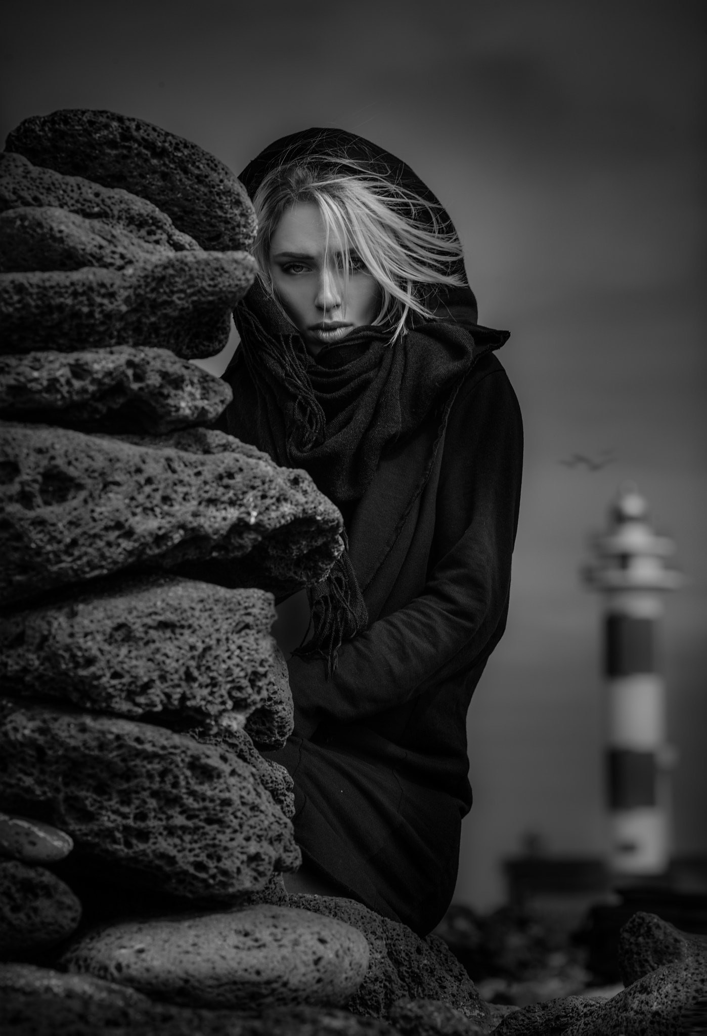 People 1398x2048 Joachim Bergauer lighthouse stones 500px women model women outdoors monochrome black coat blonde cairn