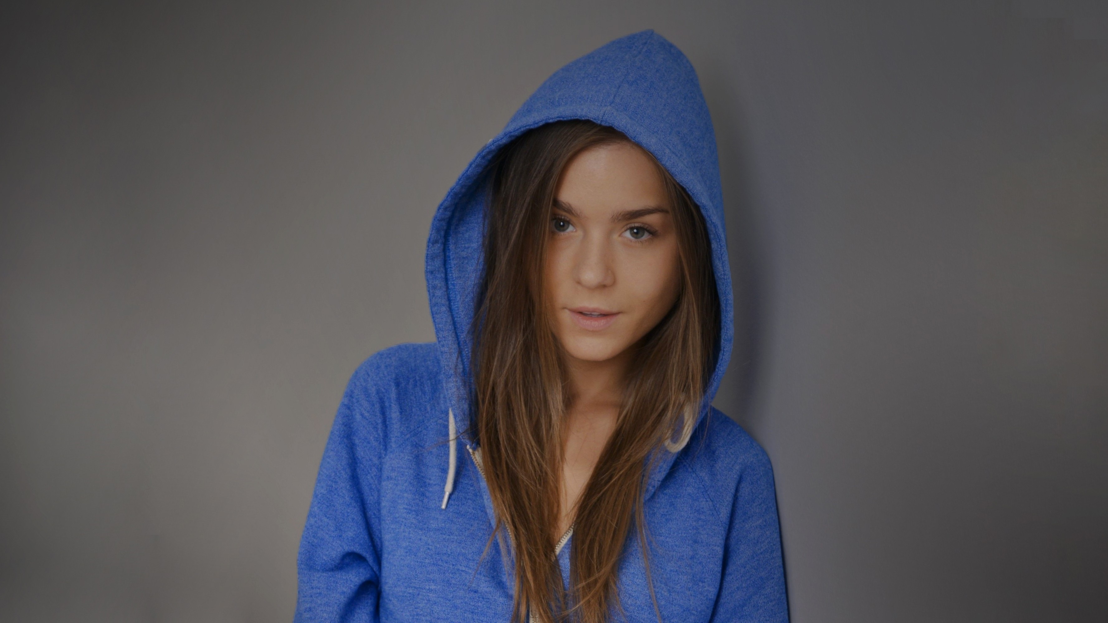 People 3556x2000 Lily Chey hoods long hair straight hair blue clothing gray background simple background looking at viewer blouses sweater women