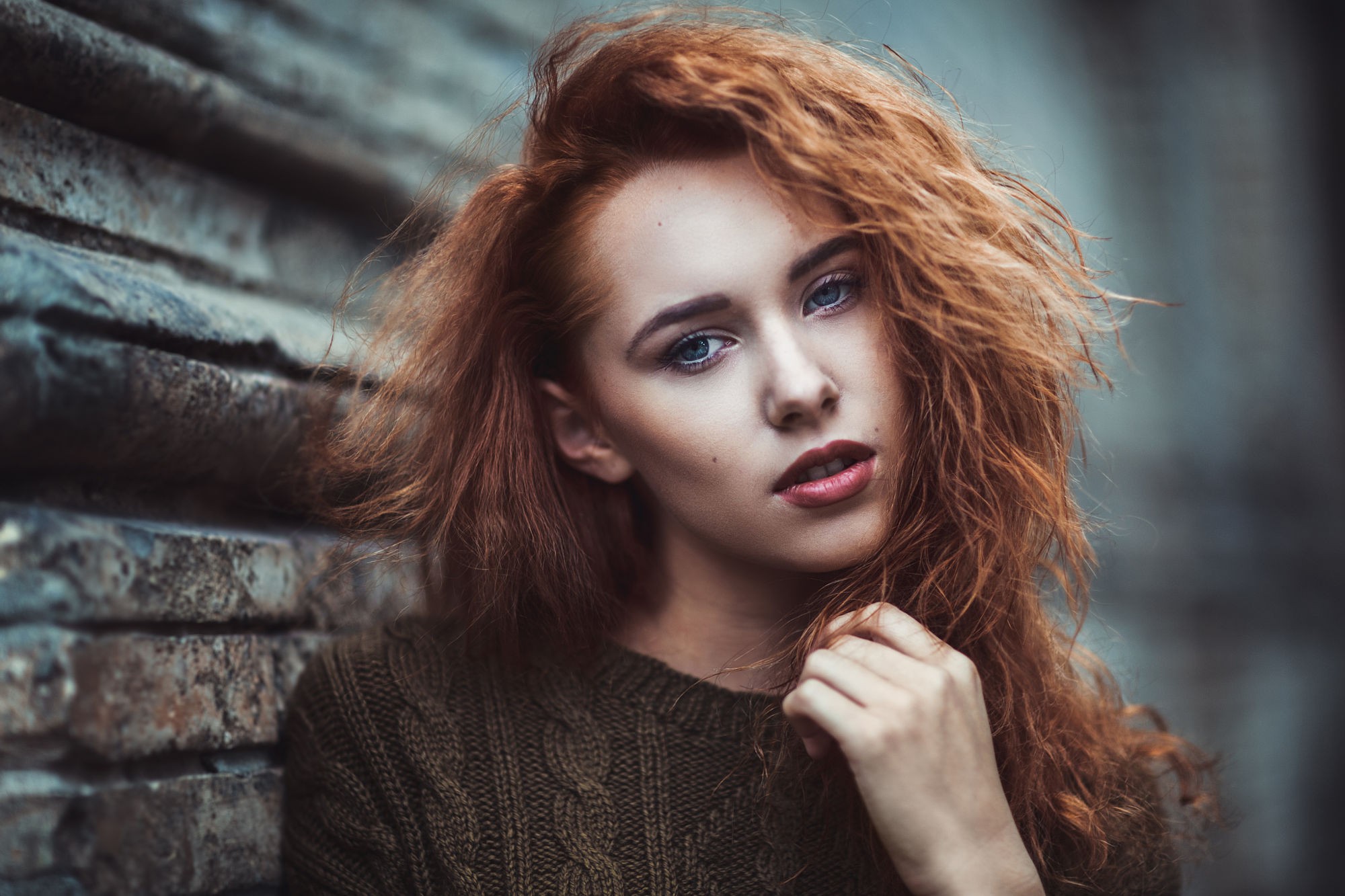 People 2000x1333 redhead women curly hair fingers wall sweater face portrait looking at viewer women outdoors urban brown sweater makeup blue eyes model