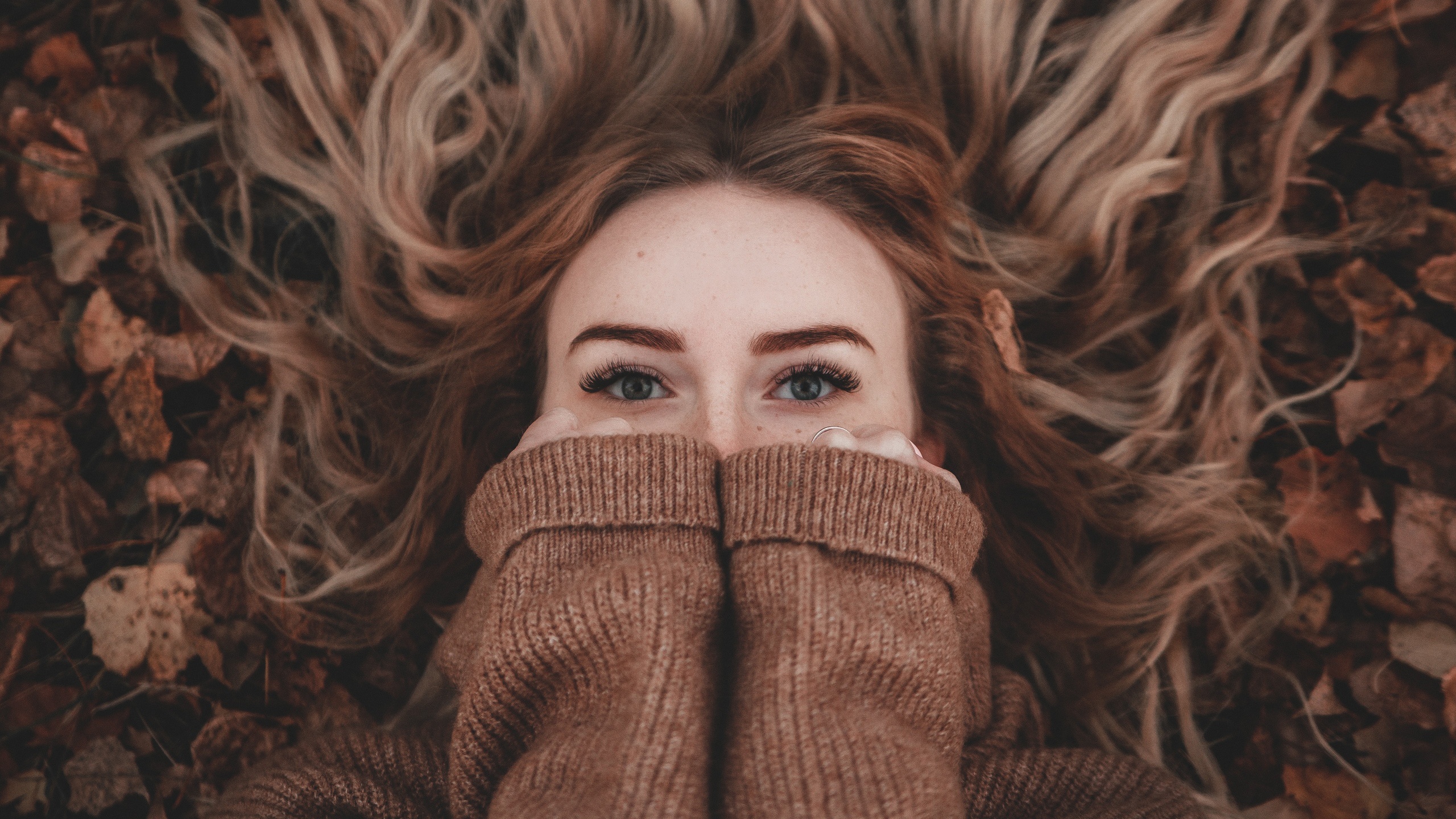 People 2560x1440 women model face portrait covering face sweater brown sweater freckles closeup