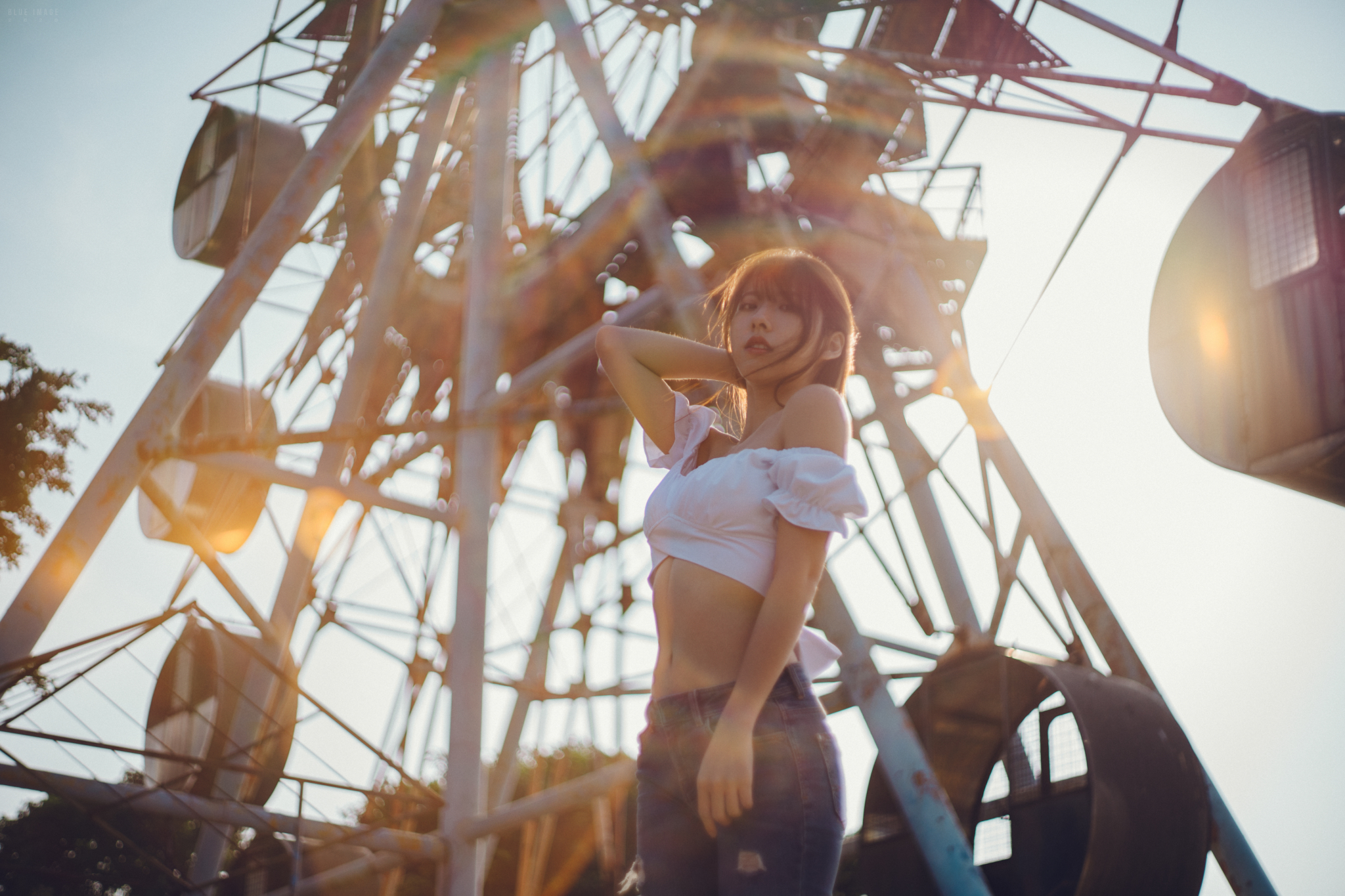 People 2048x1365 Asian women model brunette looking at viewer bare shoulders white tops jeans belly low-angle lens flare sunlight ferris wheel outdoors women outdoors sky torn jeans