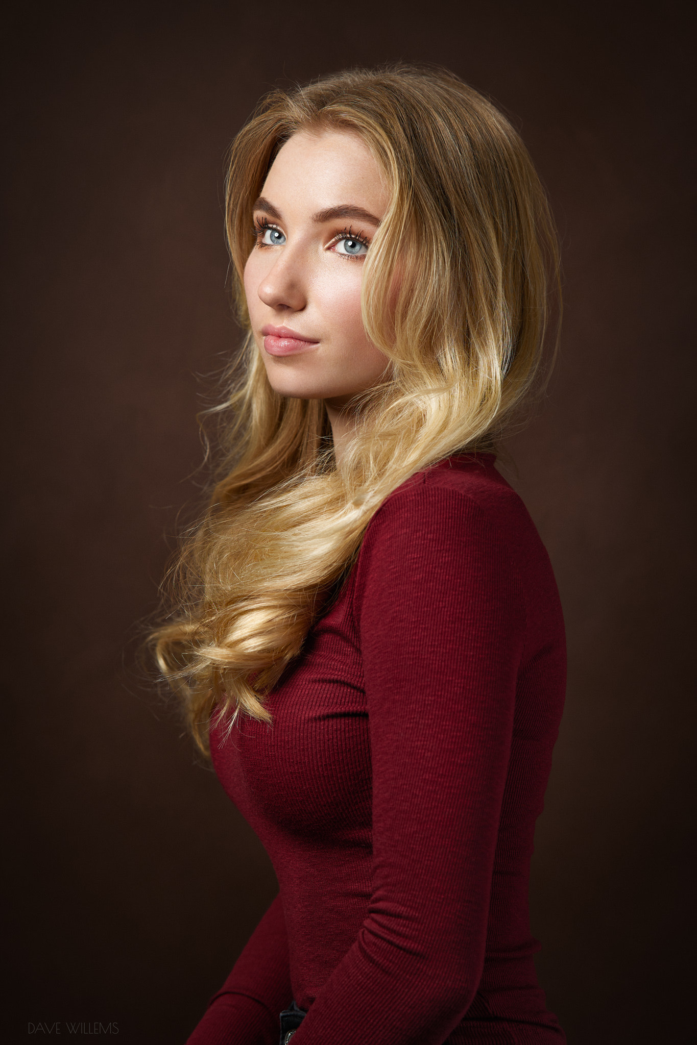 People 1365x2048 Dave Willems women blonde long hair wavy hair looking up blouses red clothing simple background gray eyes model studio looking away red sweater long sleeves portrait solo tight clothing juicy lips