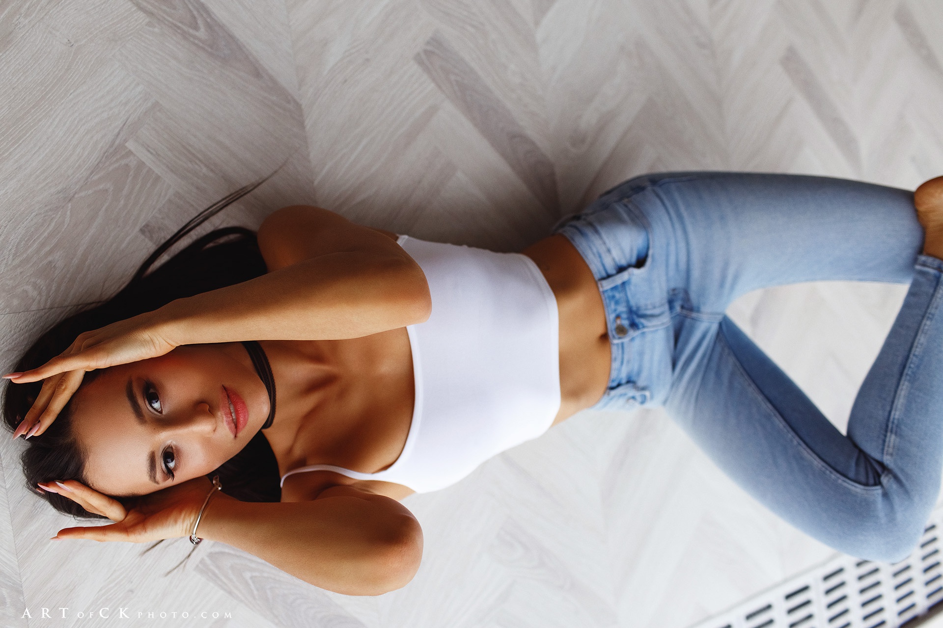 People 1920x1280 Stepan Kvardakov model women brunette dark eyes mouth lips lipstick red lipstick hips belly belly button bare midriff tank top white tank top white tops jeans bare shoulders hands in hair feet barefoot choker lying on back top view looking at viewer Anelia Yapparova