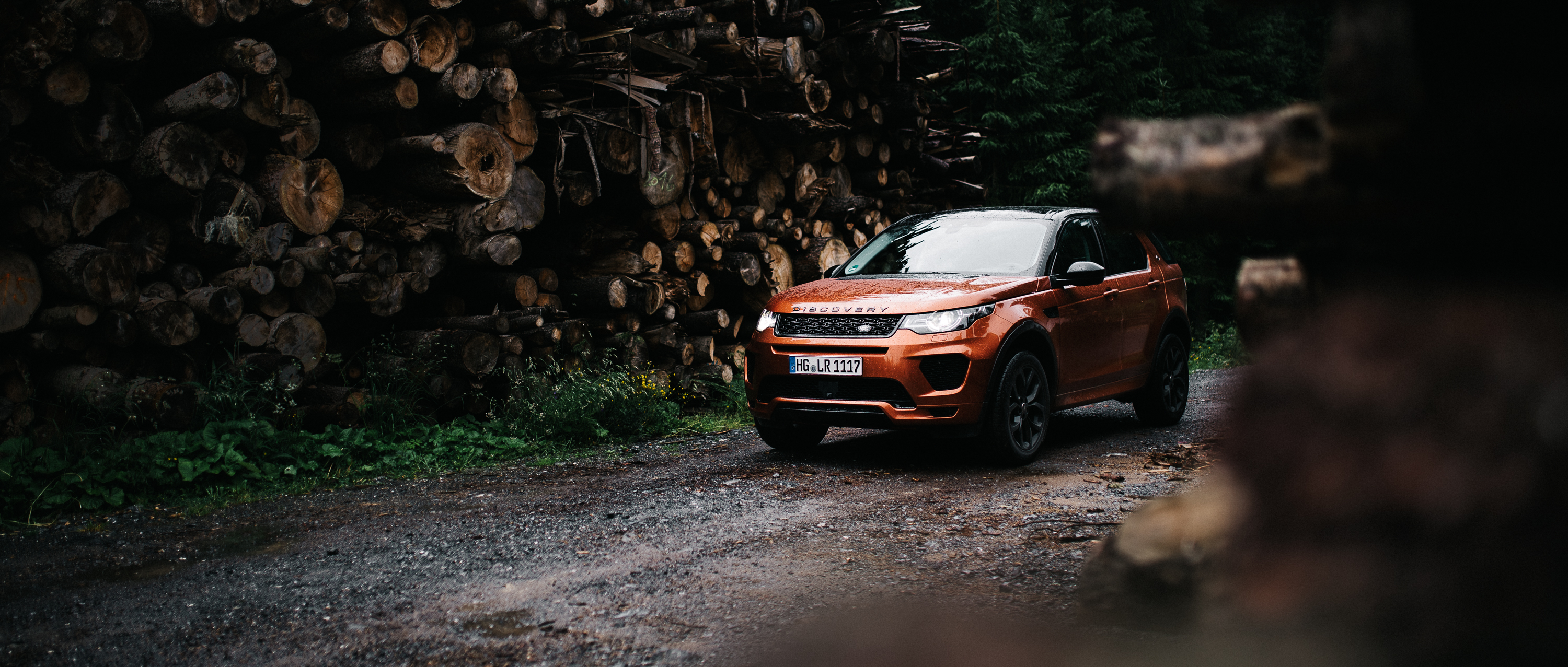 General 3000x1277 vehicle Land Rover car landscape forest tree bark rain road trees frontal view Land Rover Discovery SUV British cars