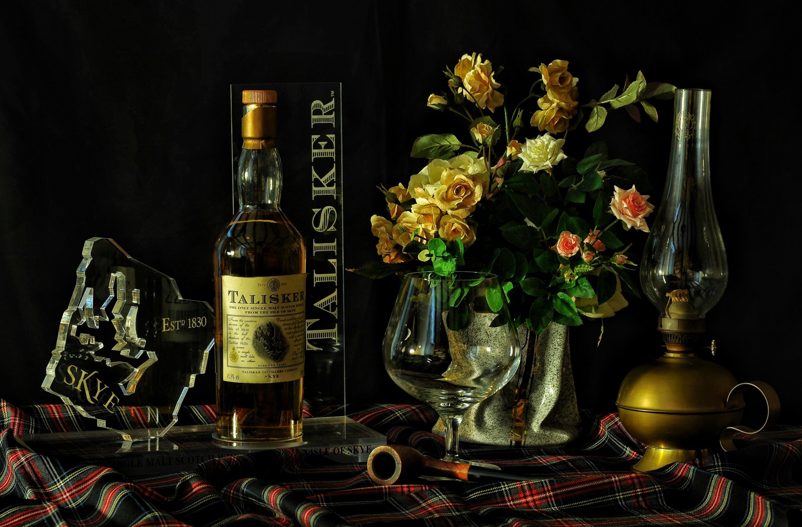 General 2560x1684 alcohol flowers bottles still life Scotch whiskey pipes Talisker lantern indoors dark background food plants vases numbers 1830 (Year)