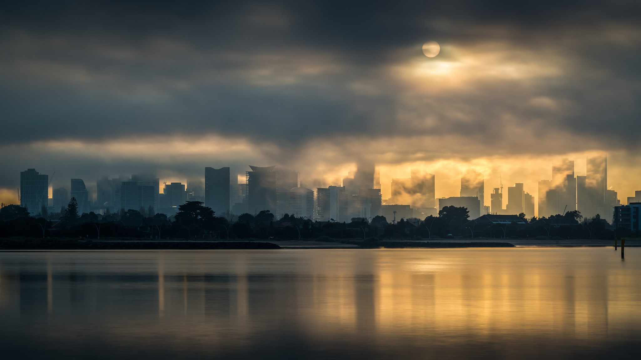 General 2048x1152 photography landscape cityscape lake clouds Sun trees building skyscraper Melbourne mist Australia