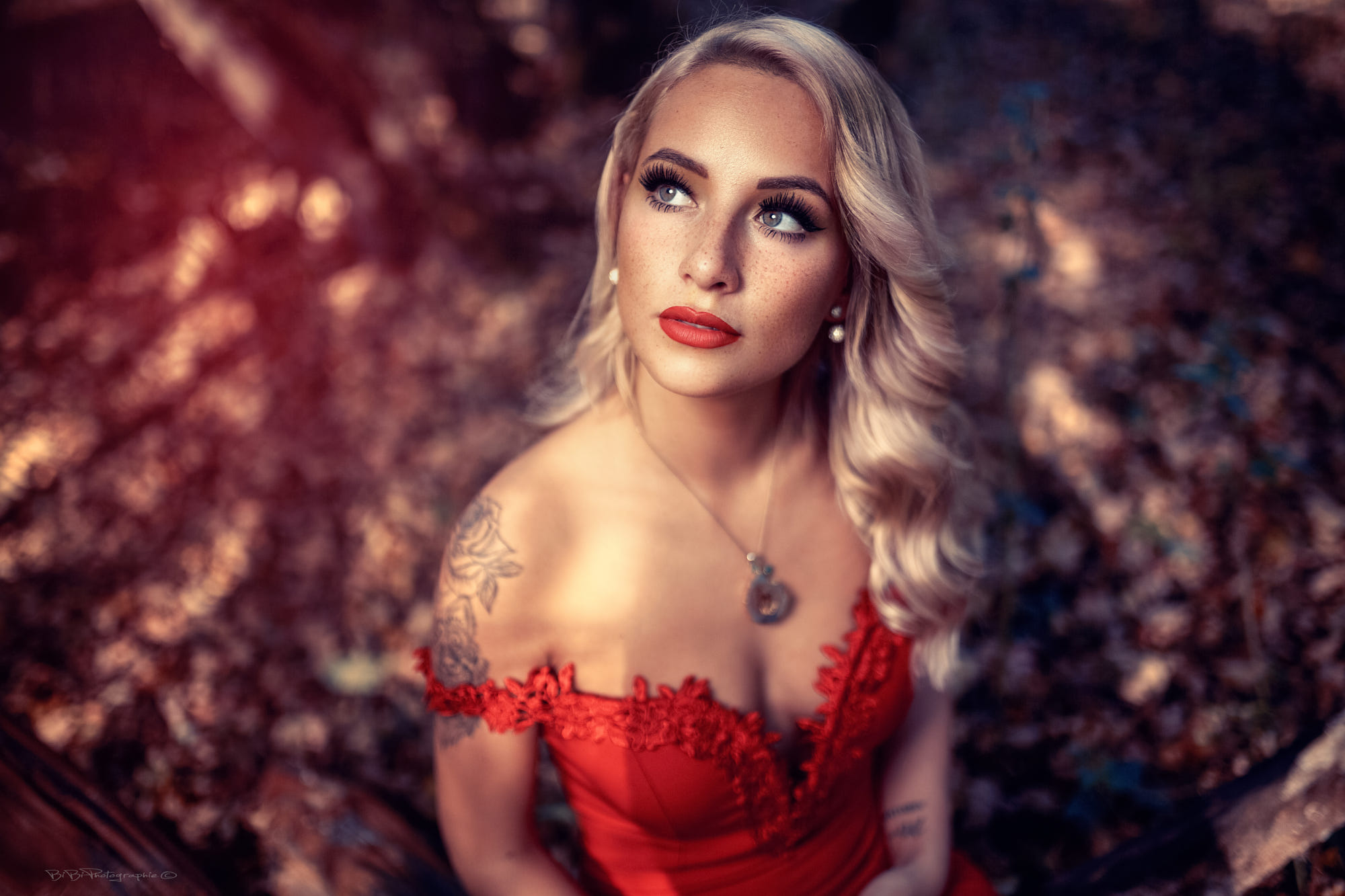 People 2000x1333 women blonde face long hair red dress women outdoors freckles red lipstick cleavage bokeh portrait no bra necklace tattoo Vincent Haetty watermarked makeup inked girls looking away dyed hair lipstick red clothing
